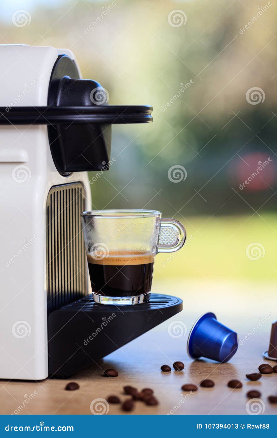 Espresso Coffee Machine On A Wooden Table Blur Green Background