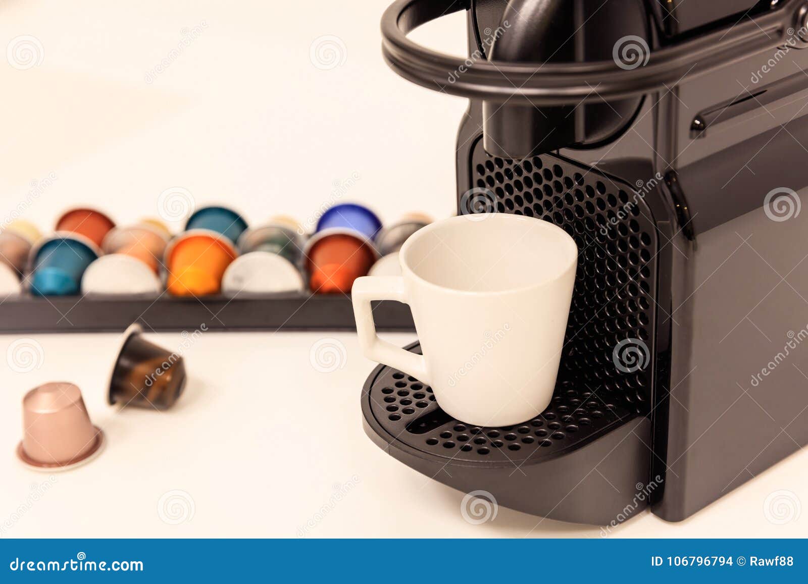 Espresso Coffee Maker Machine With Capsules Next To It Close Up