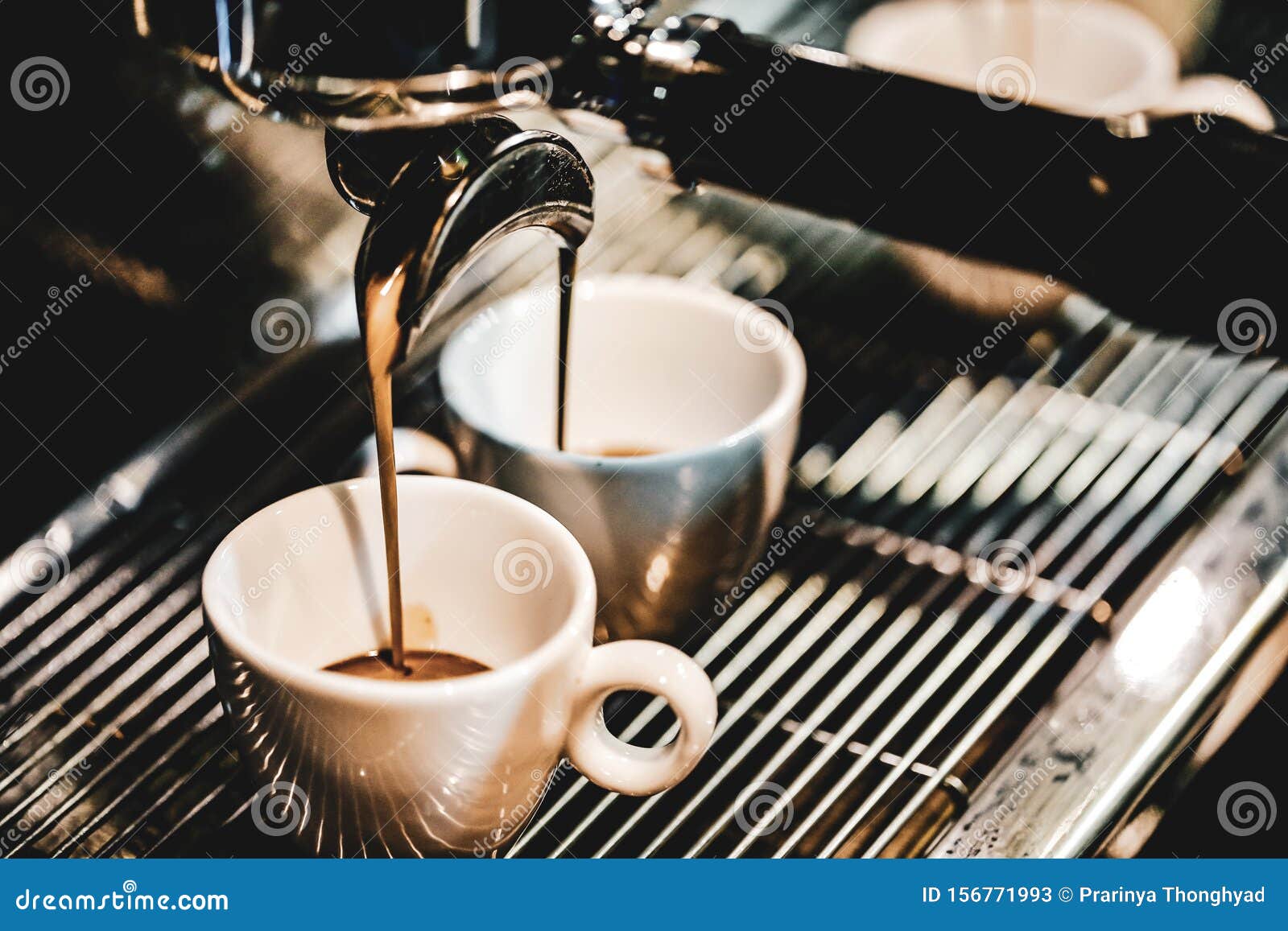 Espresso Machine Brewing a Coffee. Coffee Pouring into Glasses in