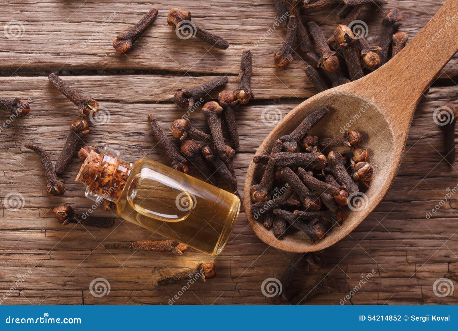 Essence of Cloves in the Bottle Macro Horizontal Top View Stock Photo