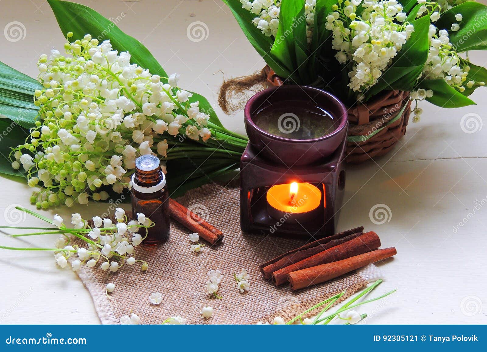 Essential Oil And Lily Of The Valley, Cinnamon On A Blue