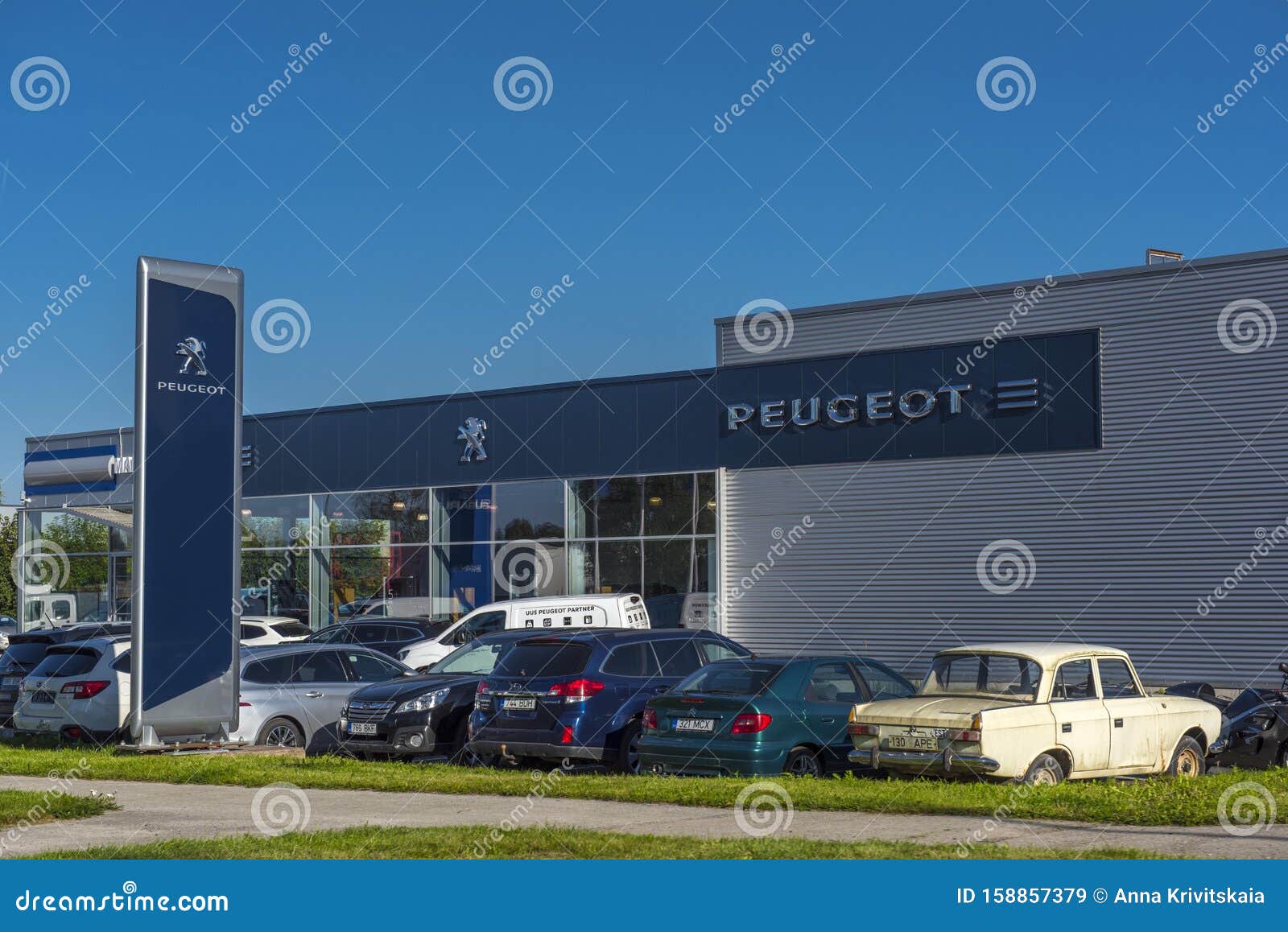 Peugeot Car Dealership And Cars In Front Of It Editorial