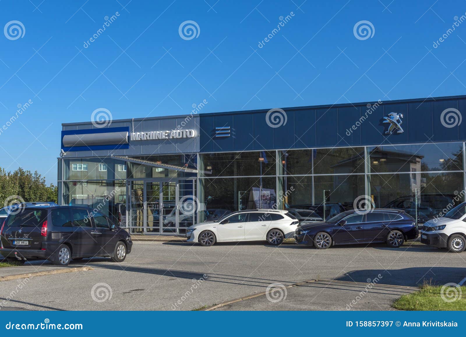 Peugeot Car Dealership And Cars In Front Of It Editorial