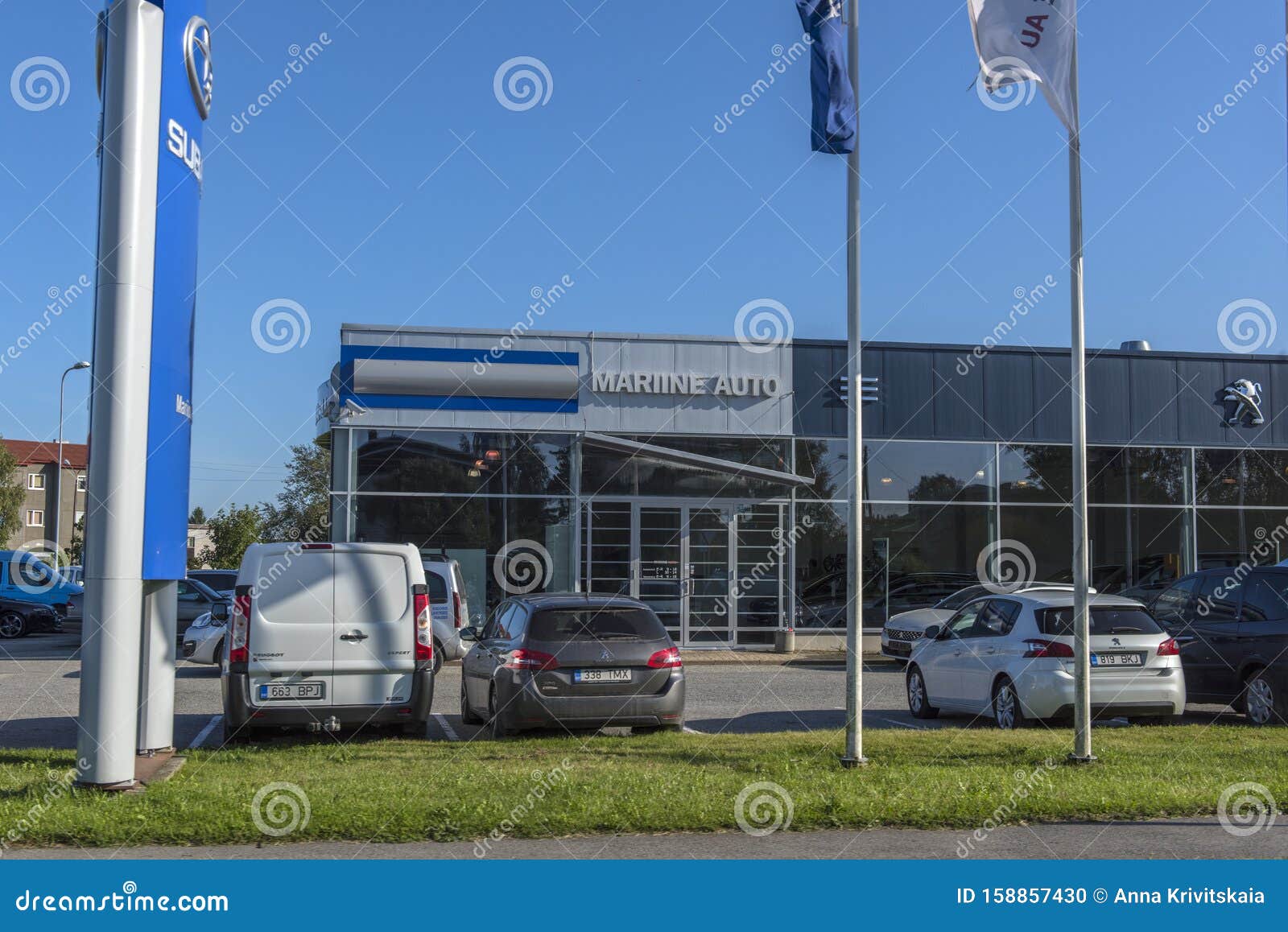 Peugeot Car Dealership And Cars In Front Of It Editorial