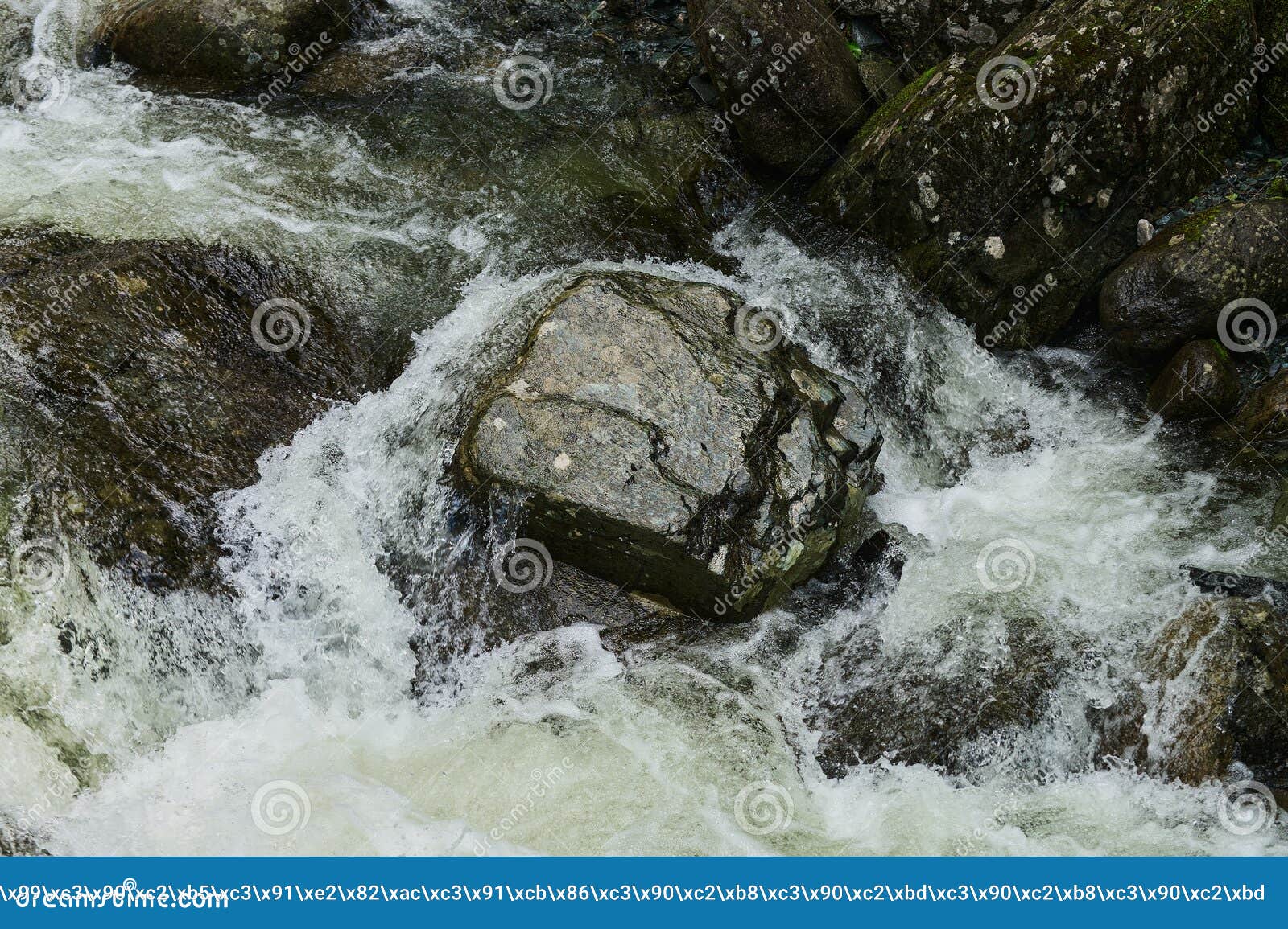 estyube waterfall at lake teletskoye in the altai mountains.