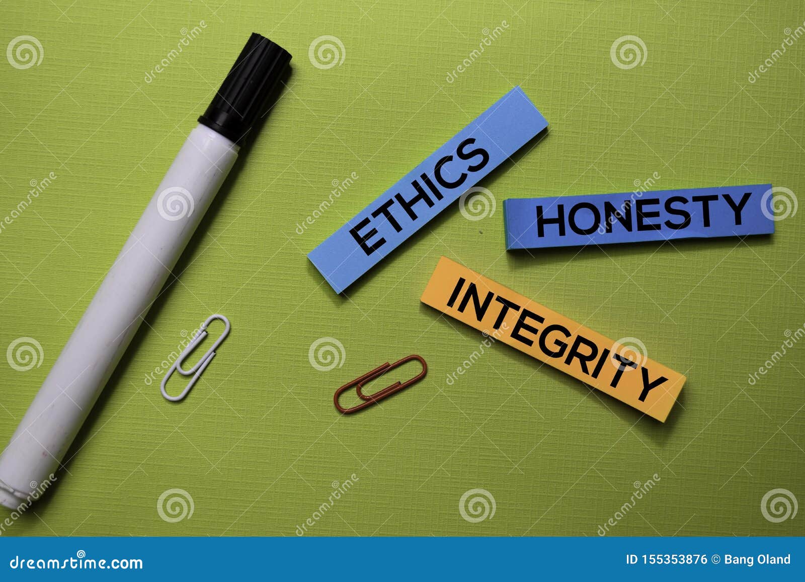 Ethics, Honesty, Integrity Text on Sticky Notes Isolated on Green Desk