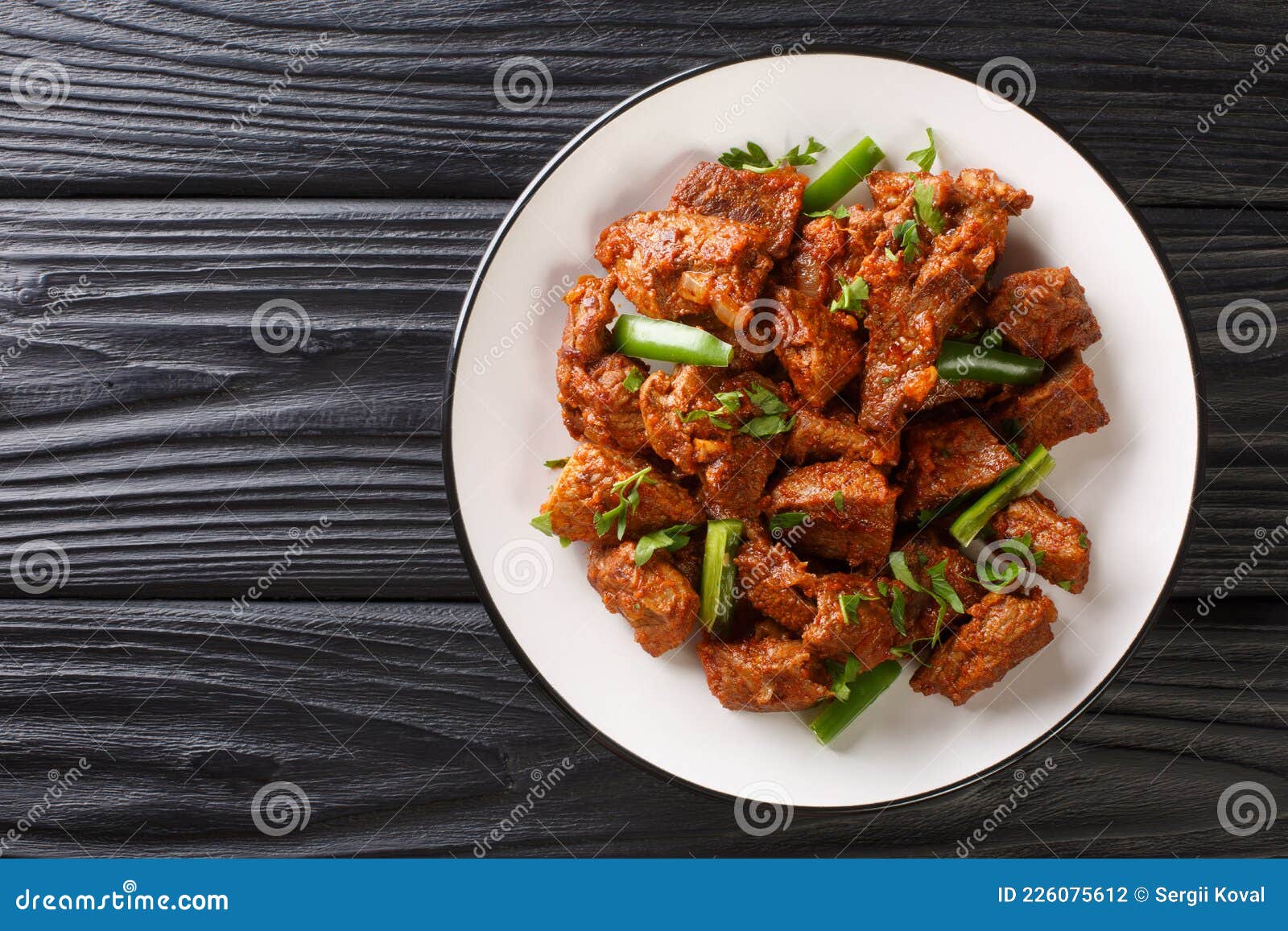 Ethiopian Cuisine Tibs Fried Beef Meat in a Spicy Vegetable Sauce Close