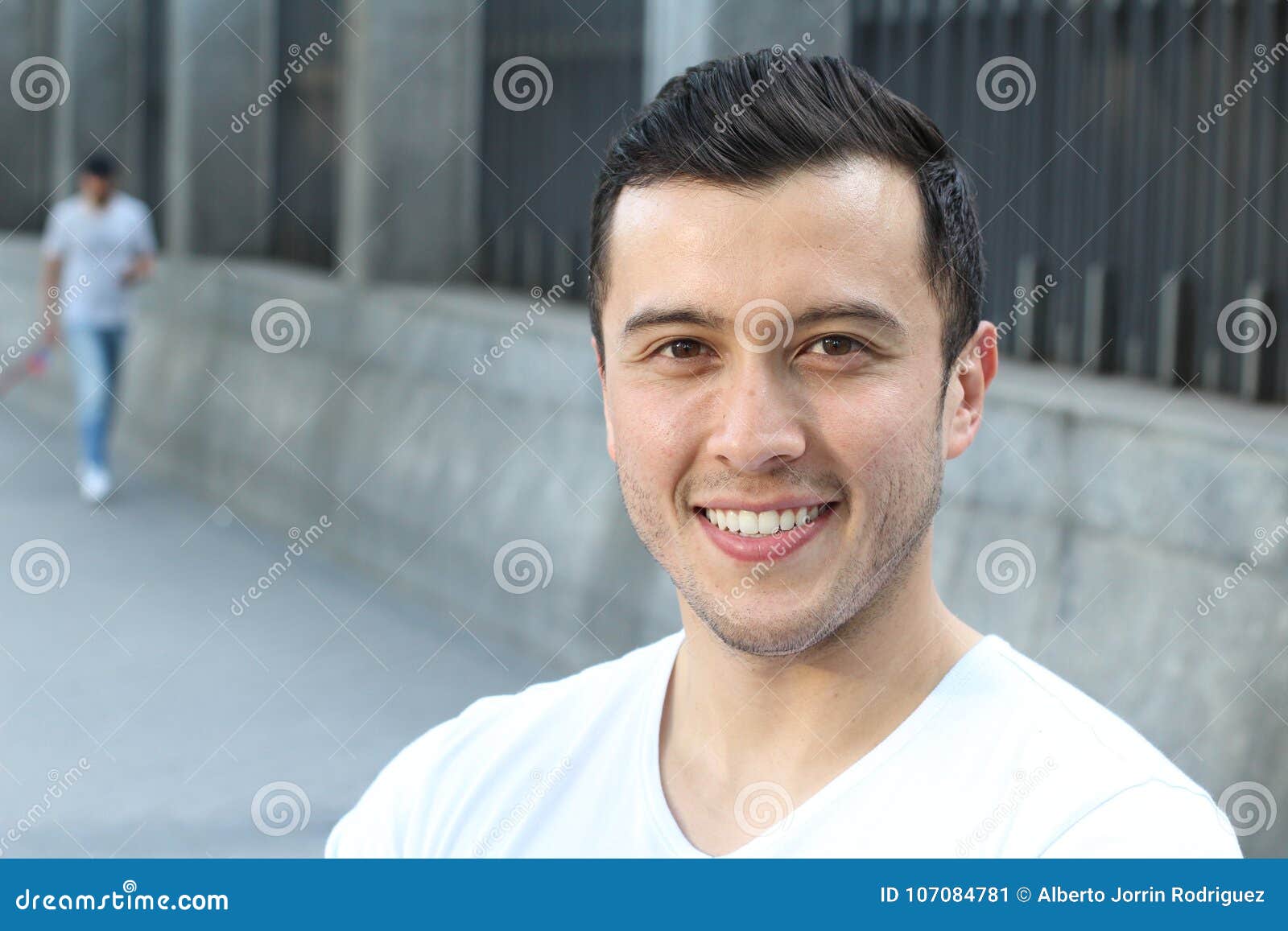 ethnically ambiguous male smiling with copy space