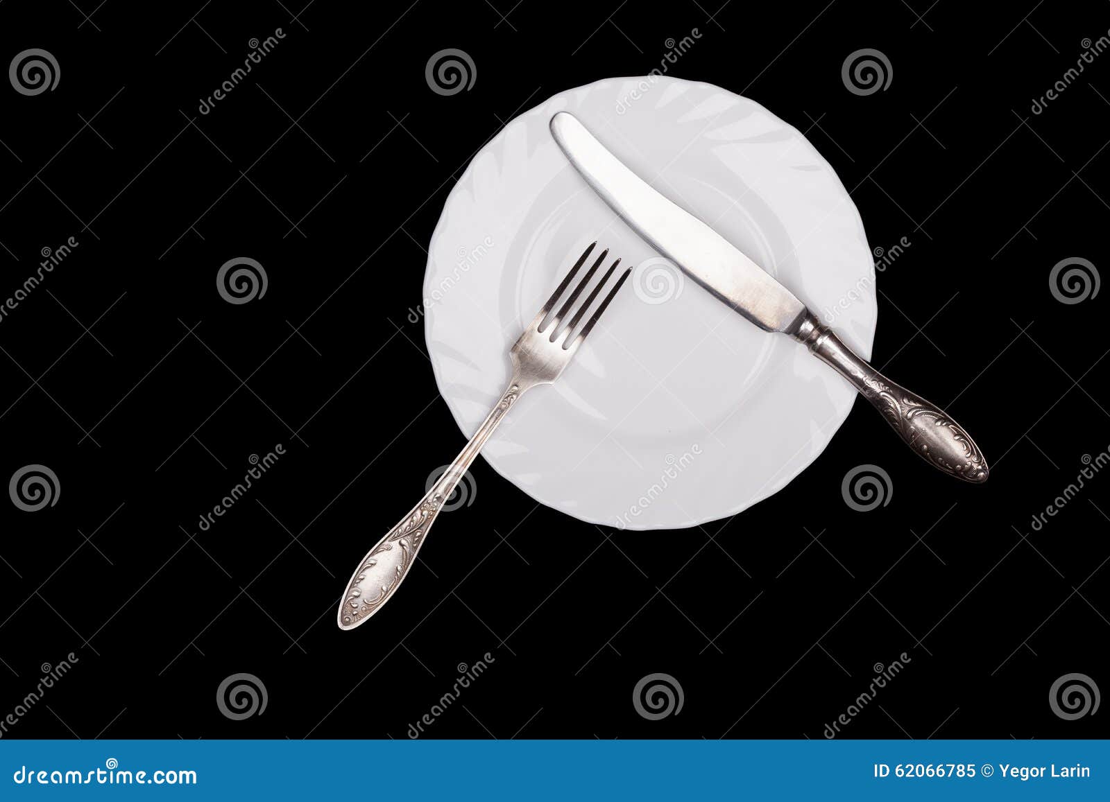 Etiquette Sign. Plate, Fork, Knife Top View Isolated on Black Stock