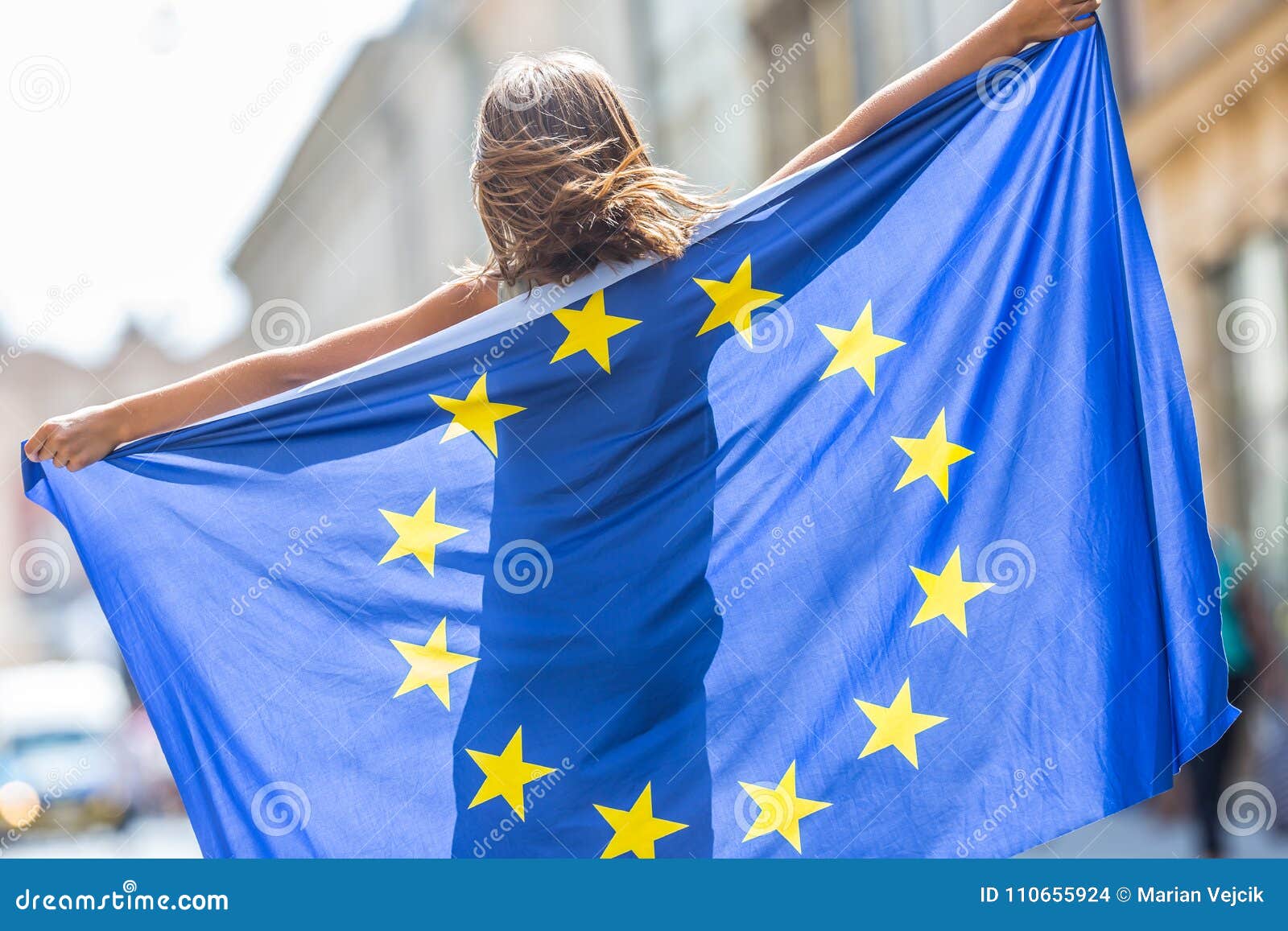 eu flag. cute happy girl with the flag of the european union. yo