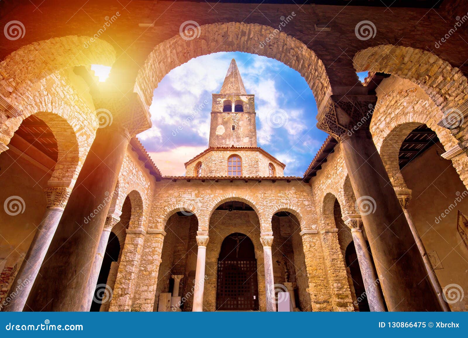 euphrasian basilica in porec arcades and tower sun haze view