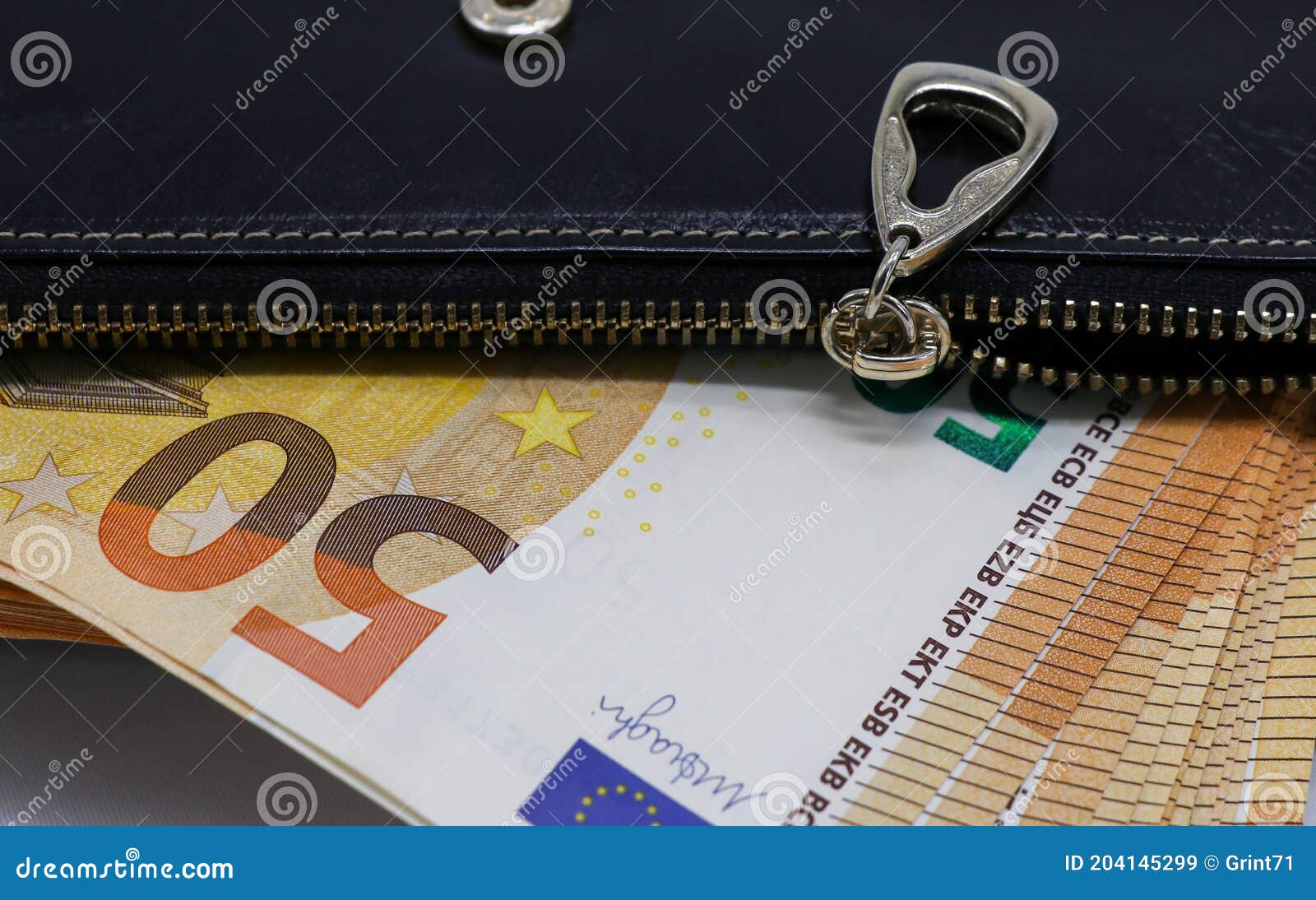 50 euro banknotes in a black leather wallet close-up. the concept of cash, cash savings, prosperity. euromoney