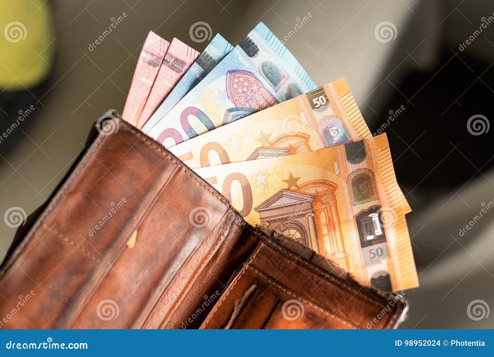 euro bills in a wallet
