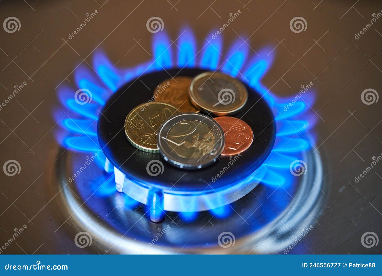 euro coins on burning stove. natural gas price concept