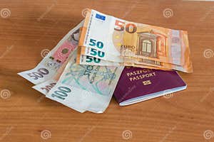 Euro EUR And Czech Koruna Banknotes CZK On Biometric Passport Stock 