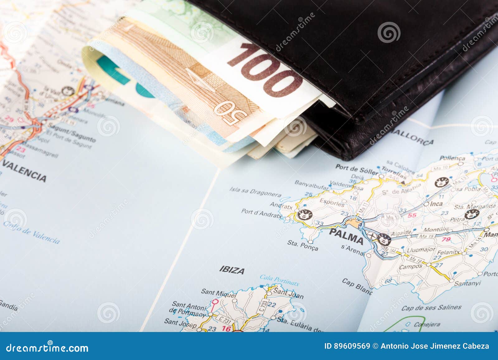 european union currency in a wallet on a map background
