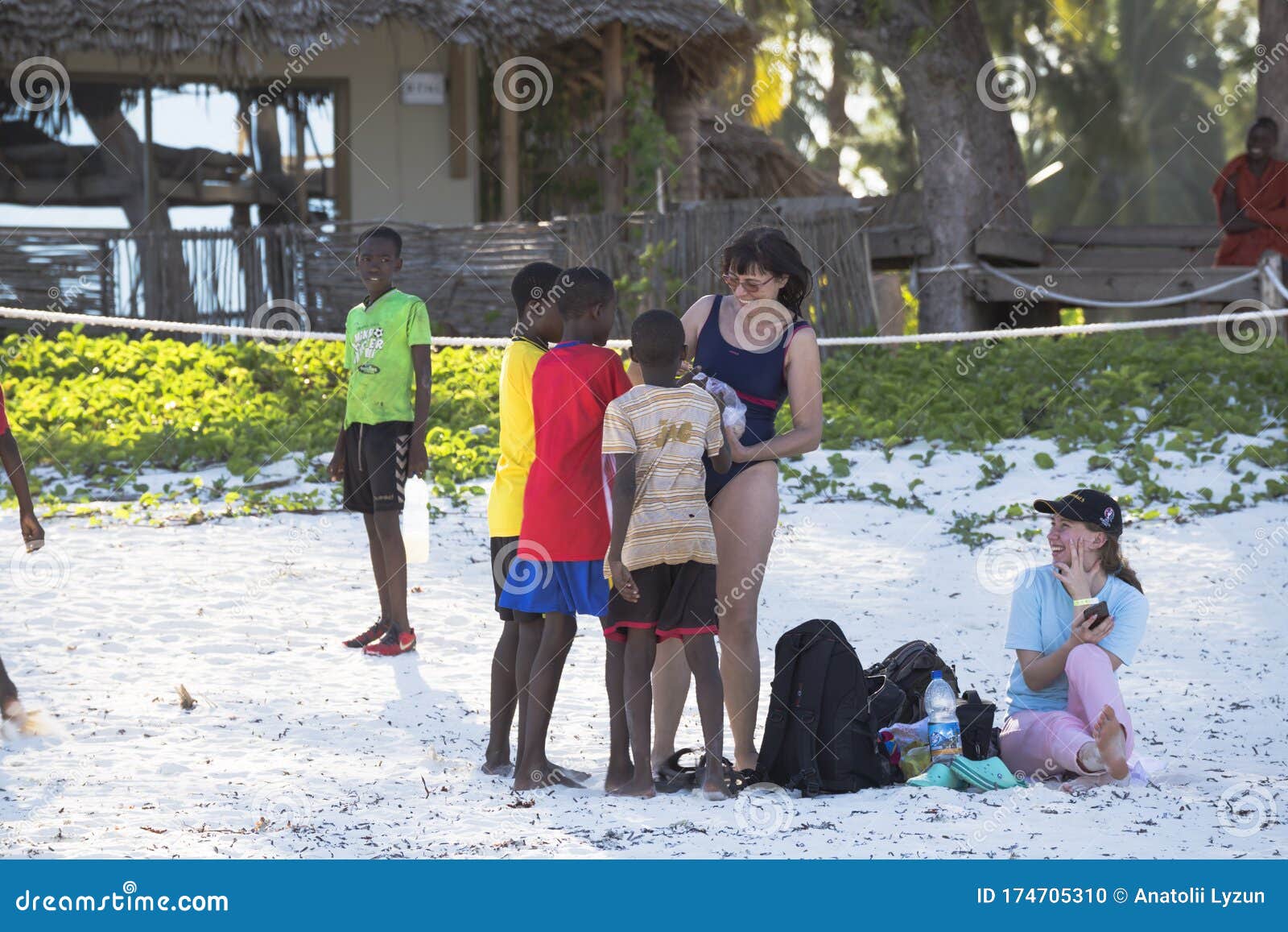 European Women Tourists among African Children Editorial Image picture