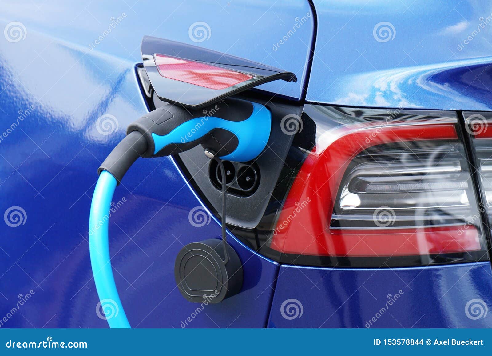 EV or Electric Car at Charging Station with Plugin Power Supply Cable