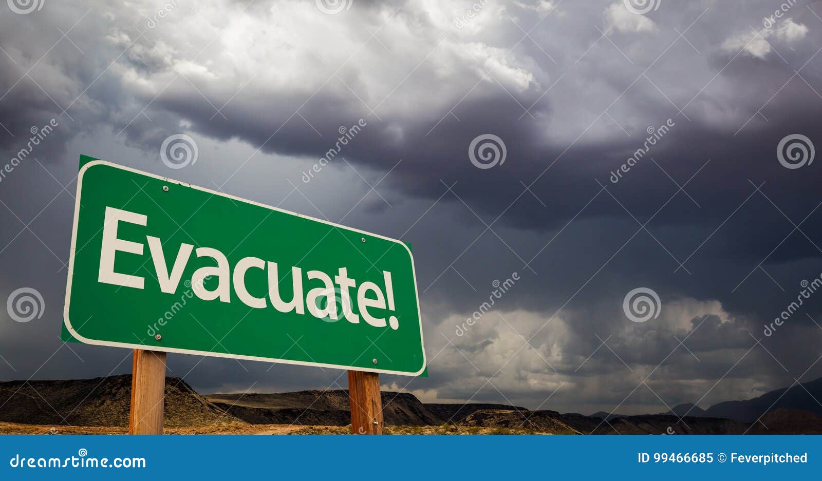 evacuate green road sign and stormy clouds