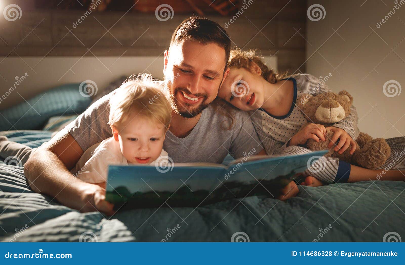 evening family reading. father reads children . book before goin