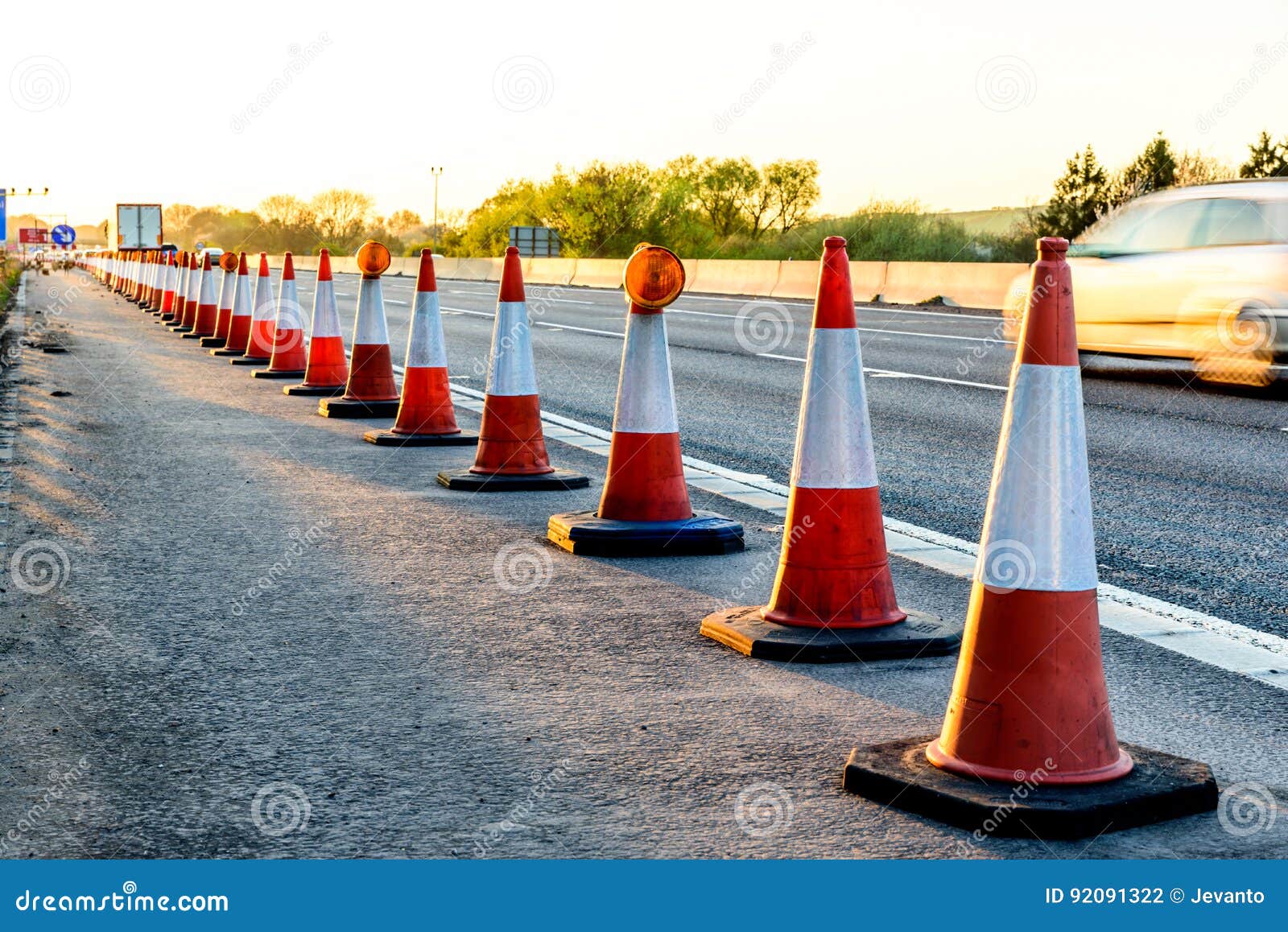 evening view uk motorway services roadworks cones