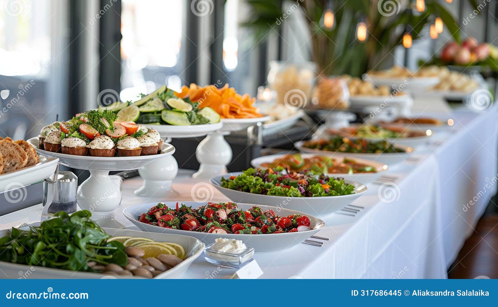 event catering buffet, long tables draped in white tablecloths showcase a selection of dishes in an elegant buffet setup