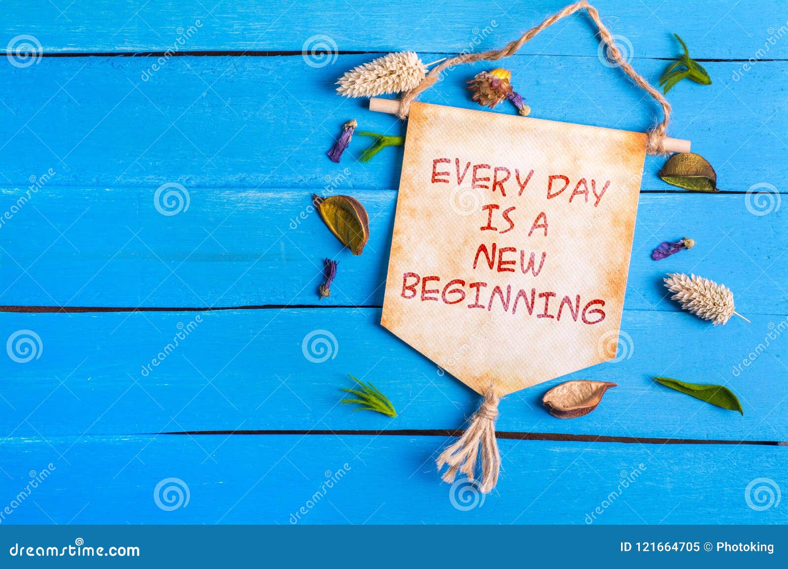 every day is a new beginning text on paper scroll