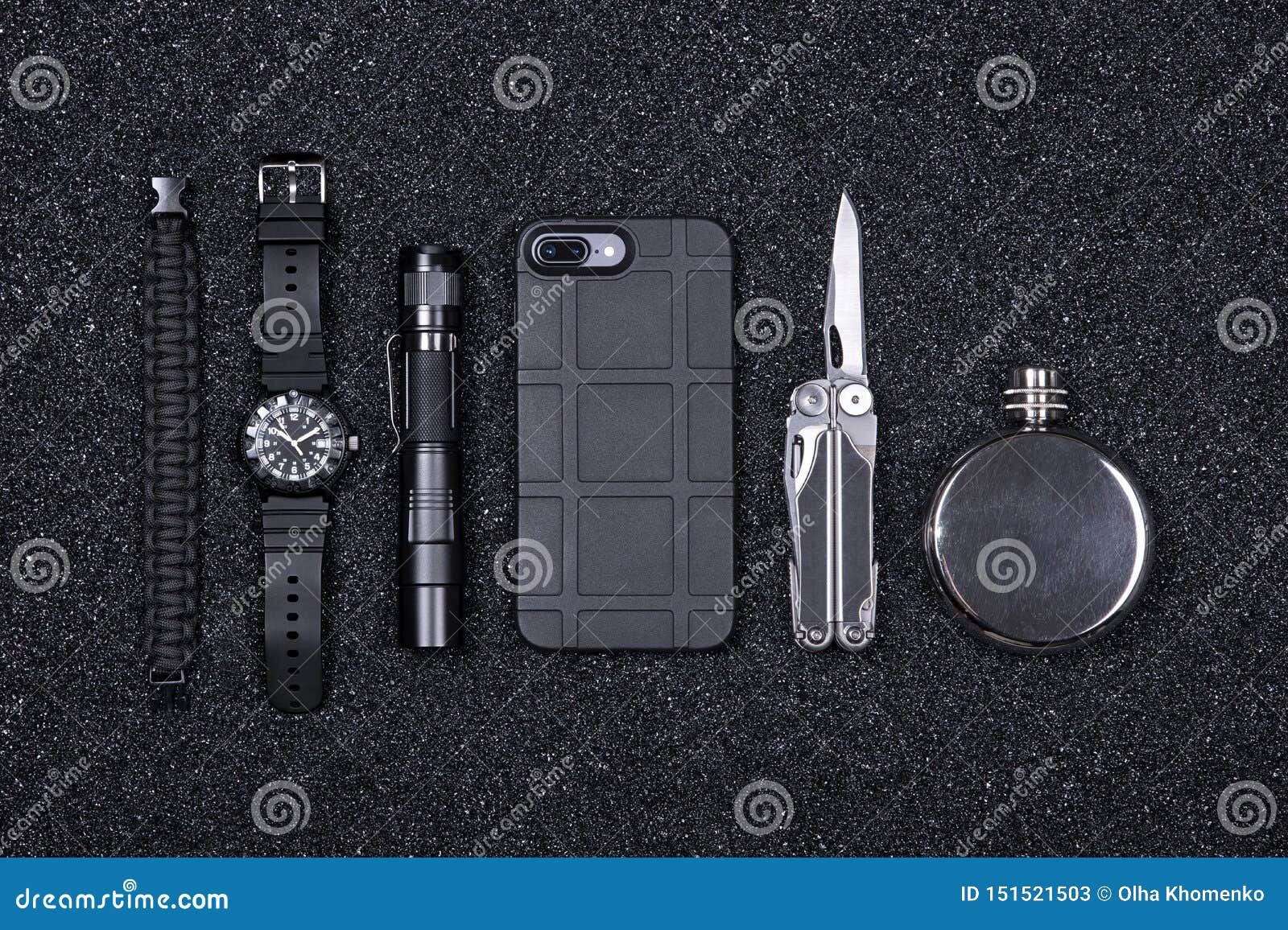 everyday carry edc military items for men- multi tool, lighter, phone, tactical watch, survival bracelet,flashlight and flask.