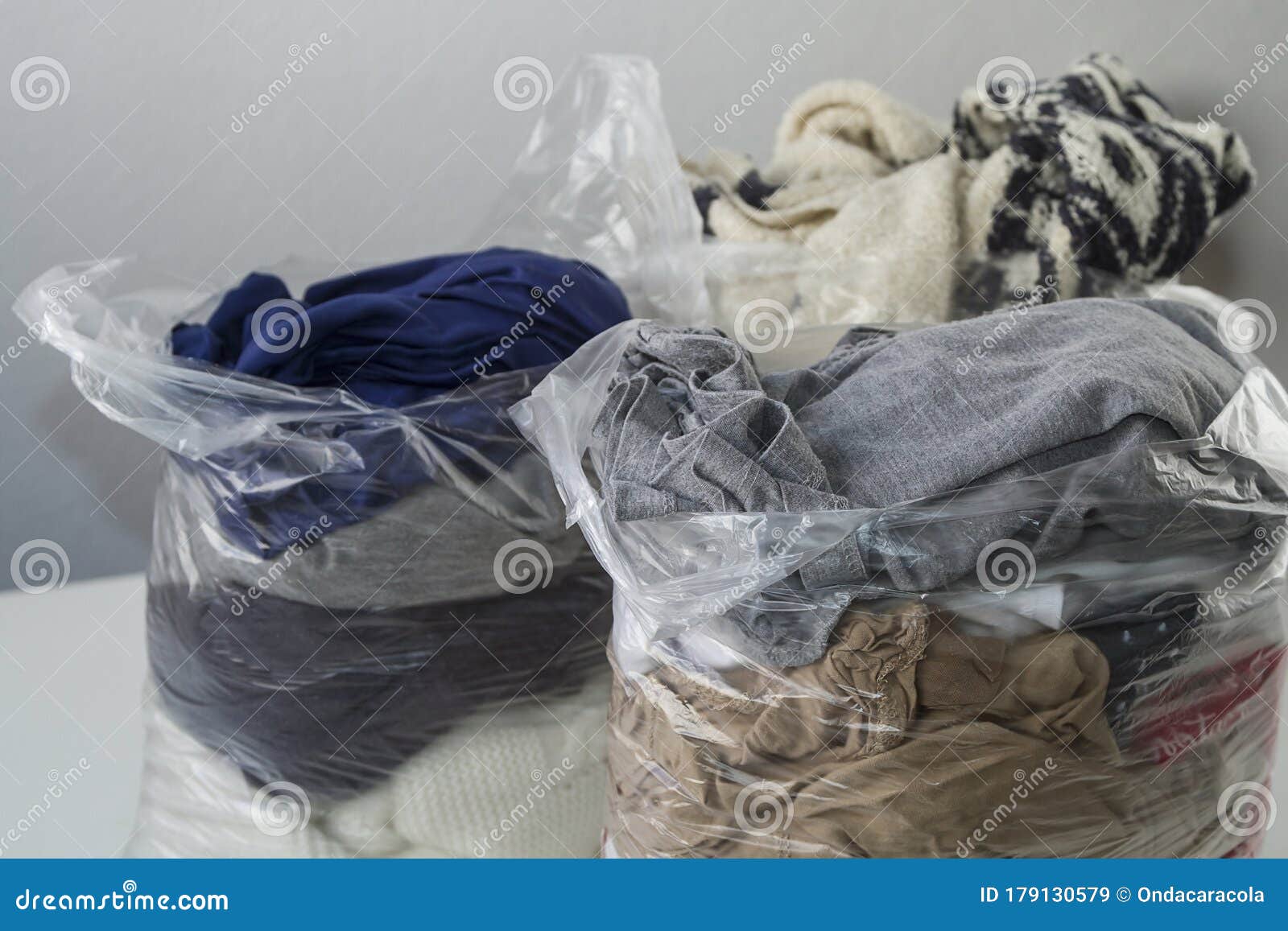 Clothes in plastic bags stock image. Image of antiseptic 179130579