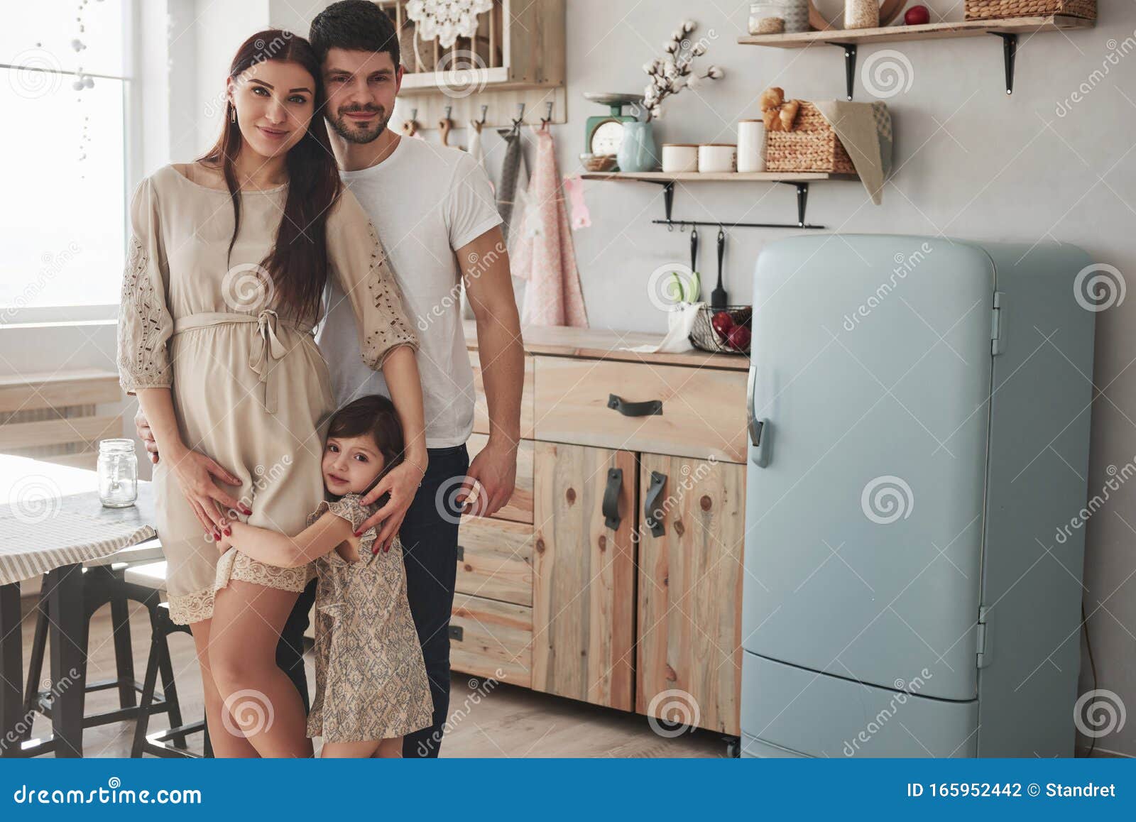Everyone Hugs Each Other. Cute Family Photo of Pregnant Mother, Father ...
