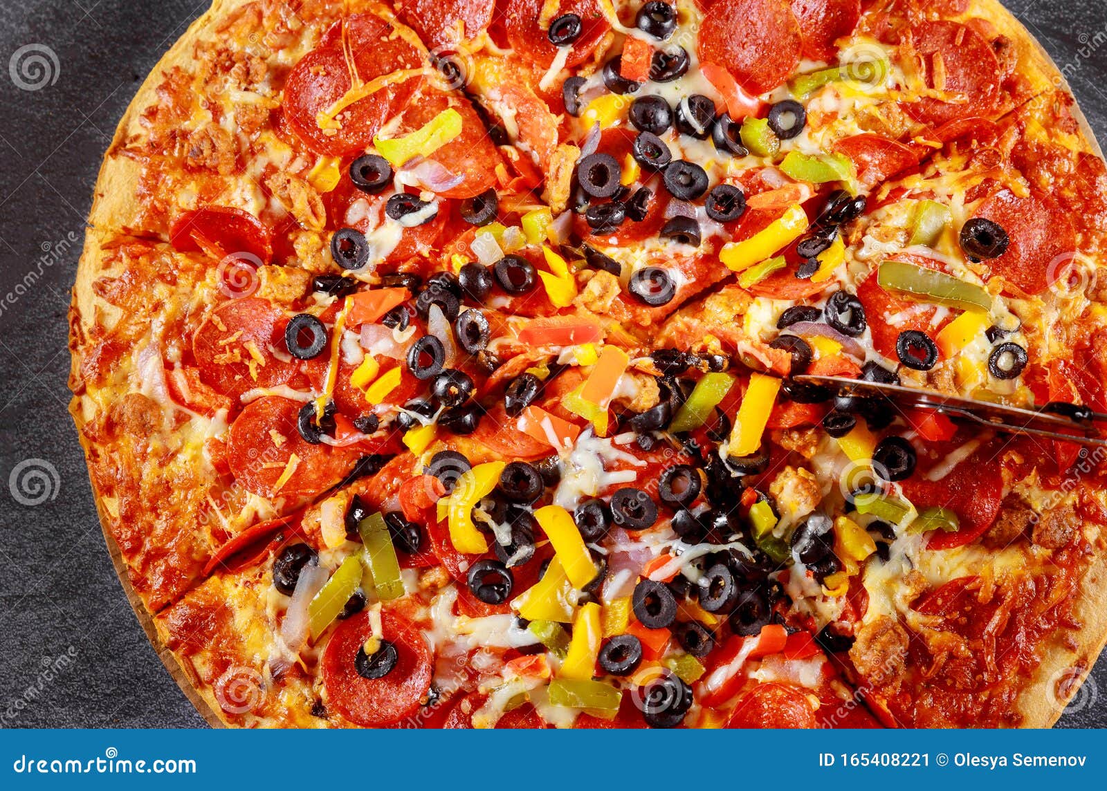 Everything Pizza with Black Olives and Pepperoni. Close Up. Stock Image