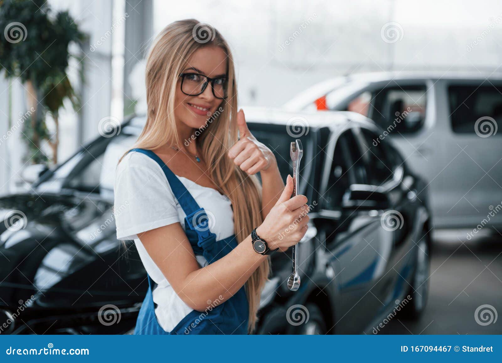 Everything Will Be Okay with Your Vehicle. Nice Blonde Woman Repairer ...