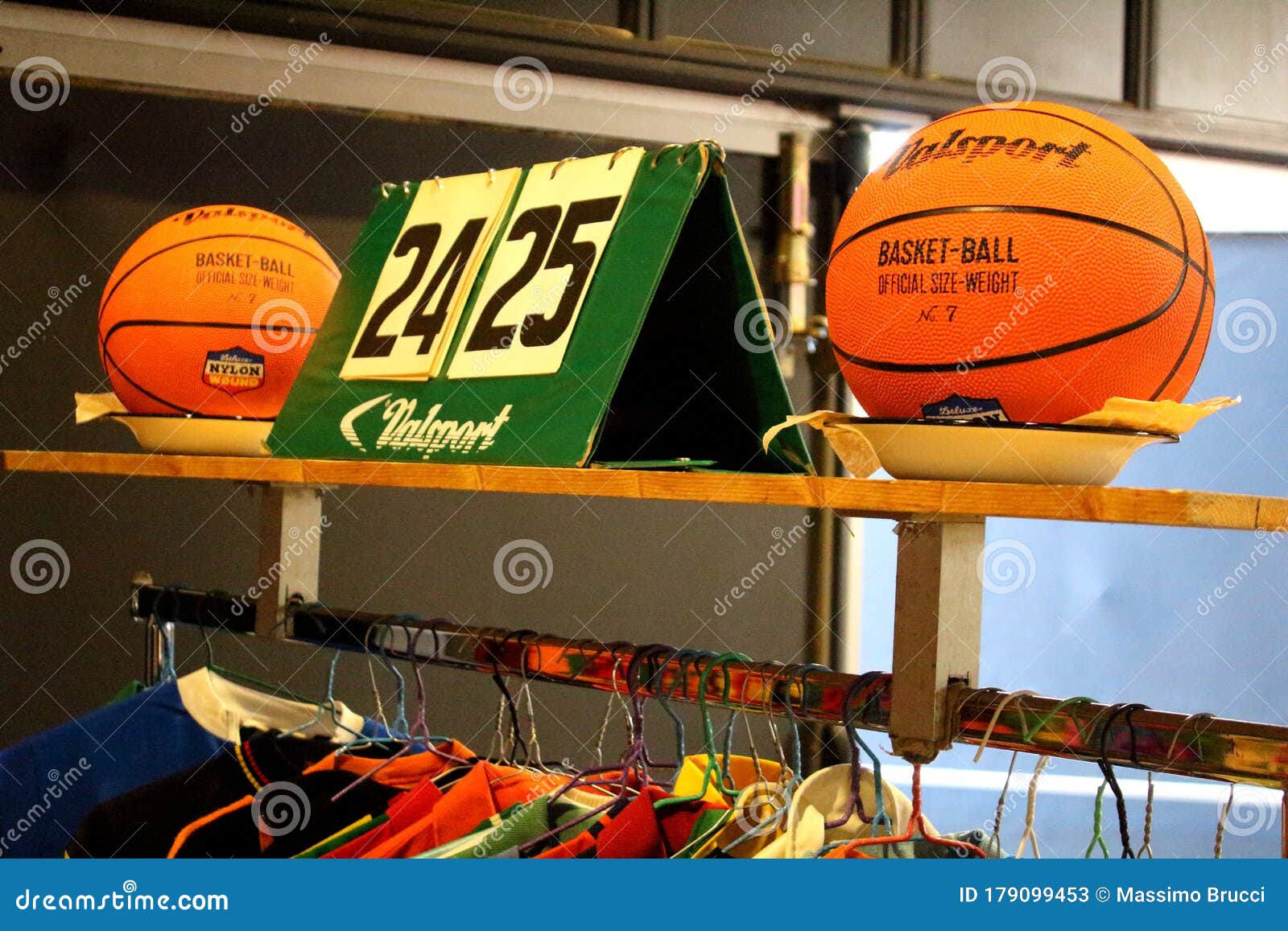 old basketballs and scoreboards at a vintage market