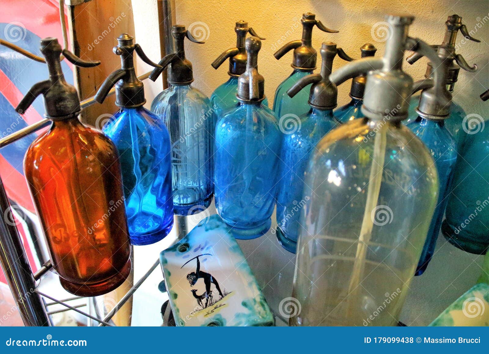 old soda water bottles in an antique shop