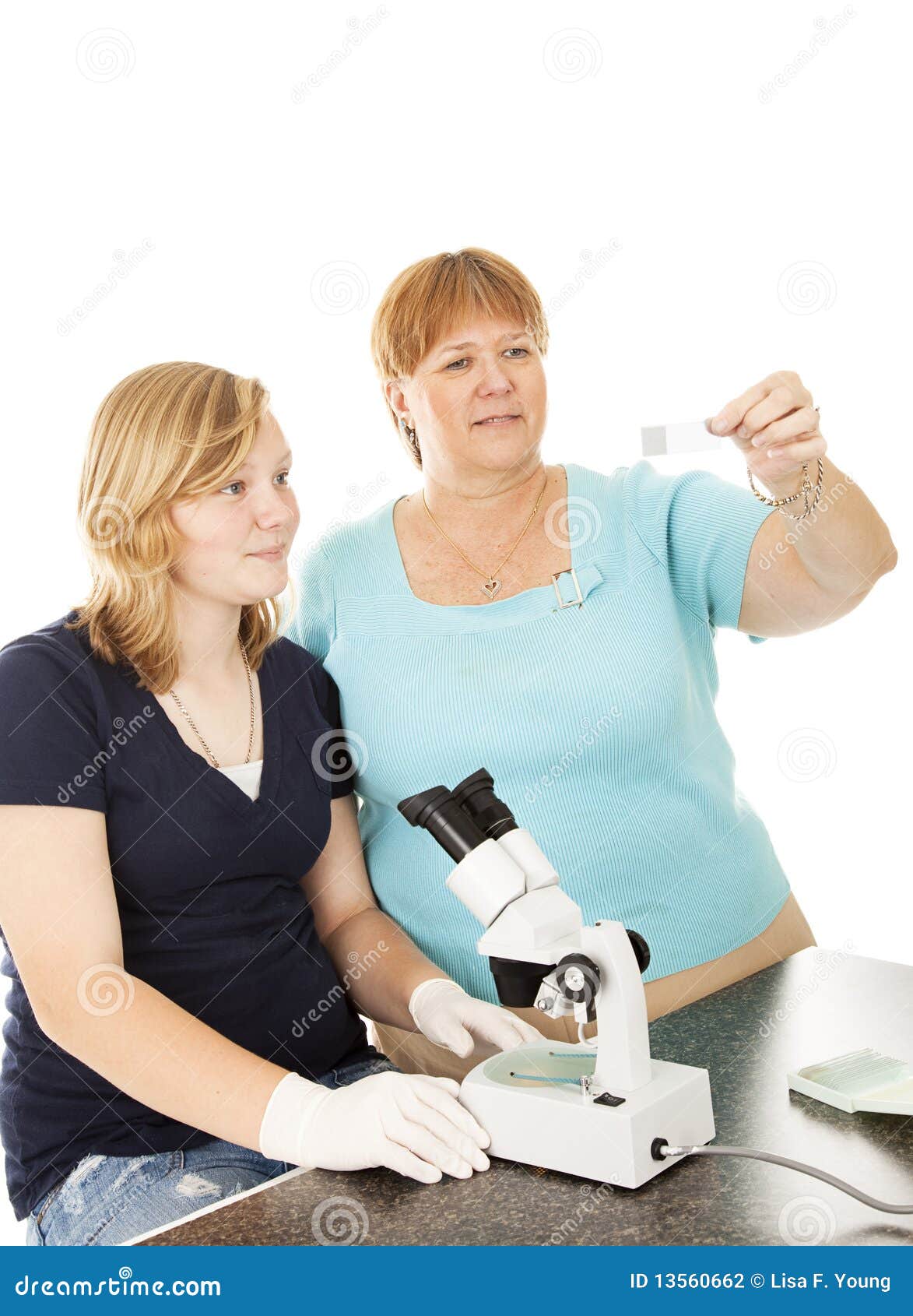 Examining Slide in Science Class Stock Photo Image of girl