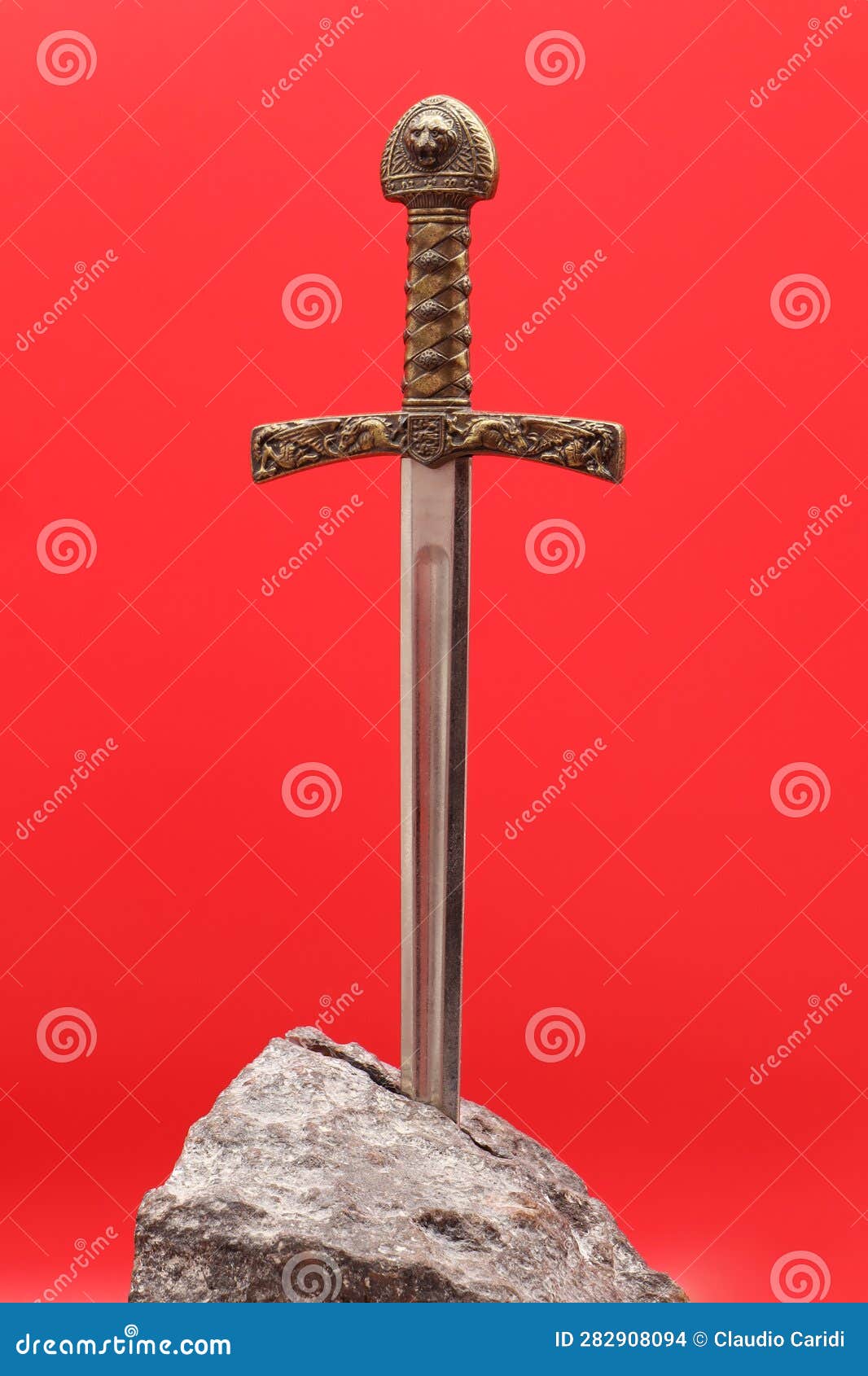 Excalibur, the Mythical Sword in the Stone of King Arthur on Red