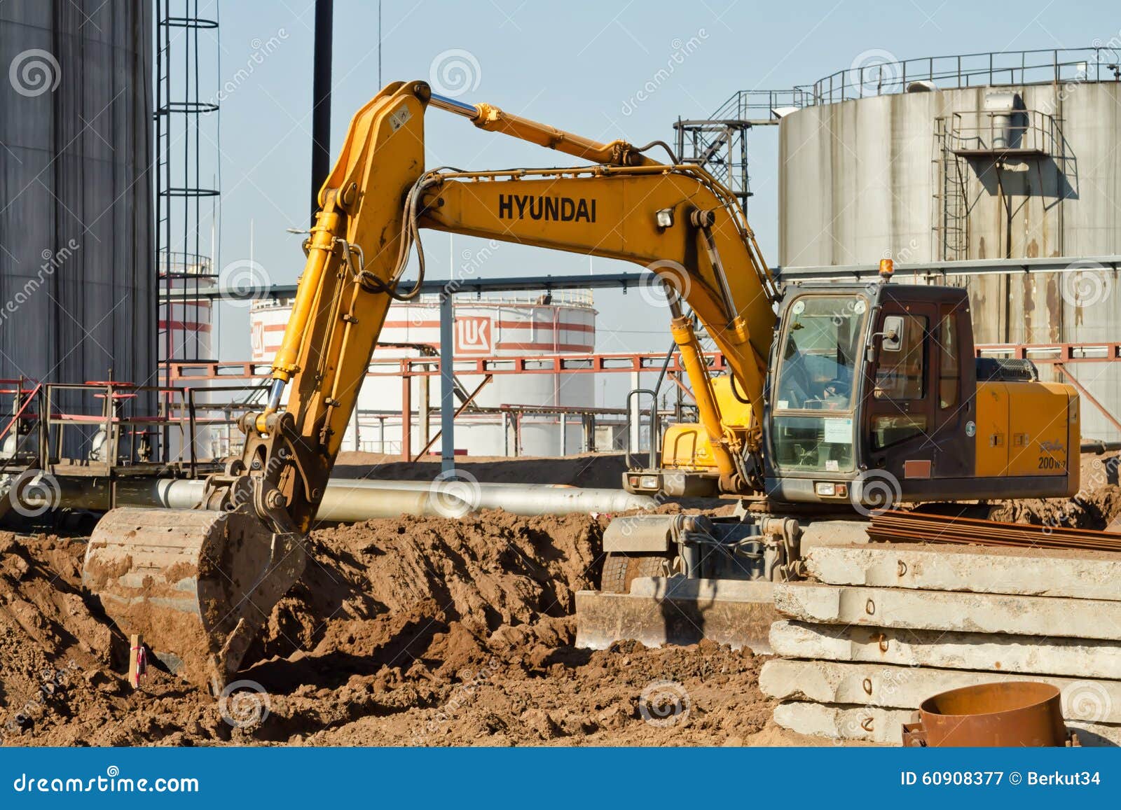 Excavator Performs Excavation Work In Clay Stock Photo, Picture and Royalty  Free Image. Image 99734842.