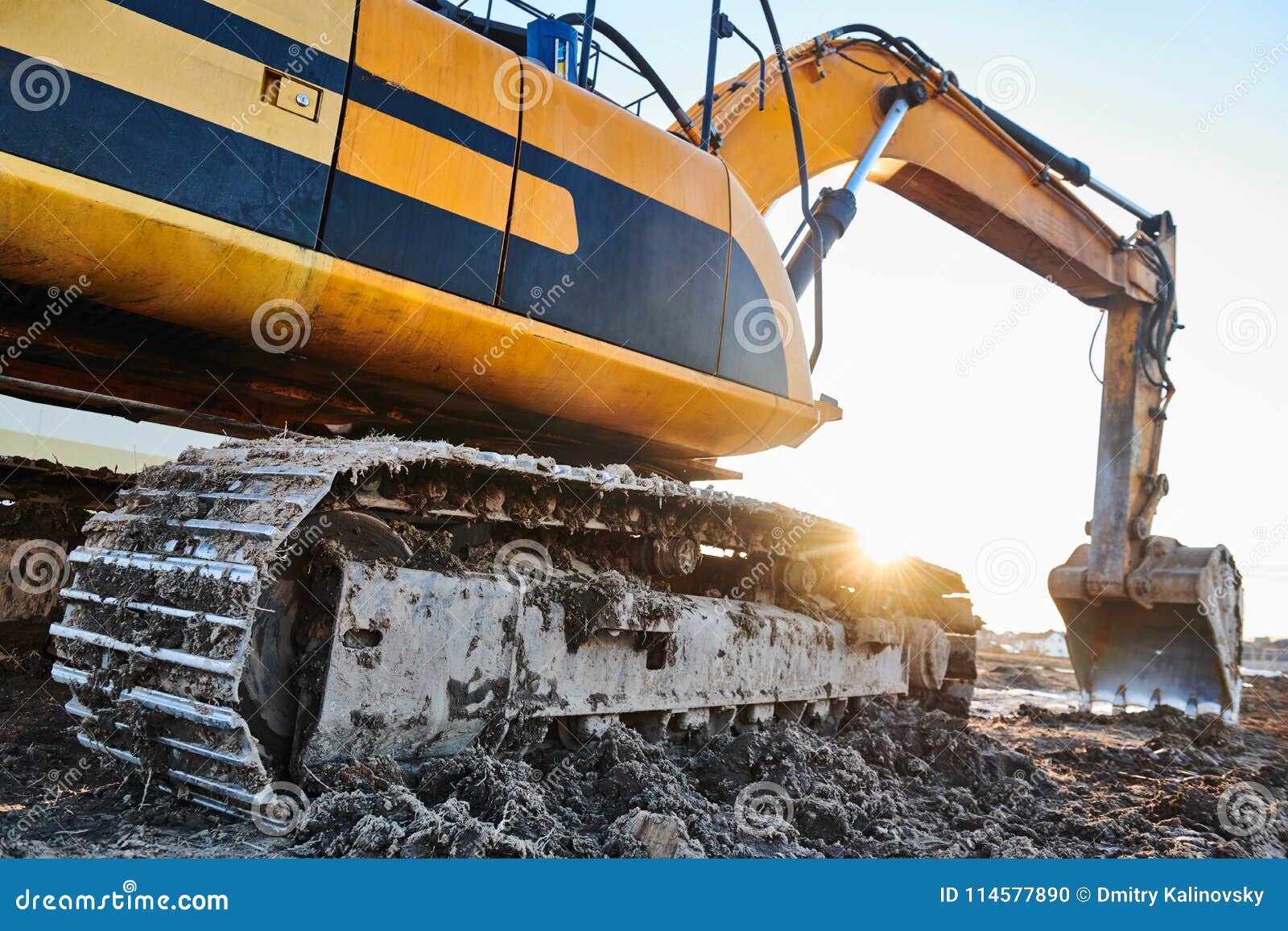 excavation work. excavator at construction site with sunset