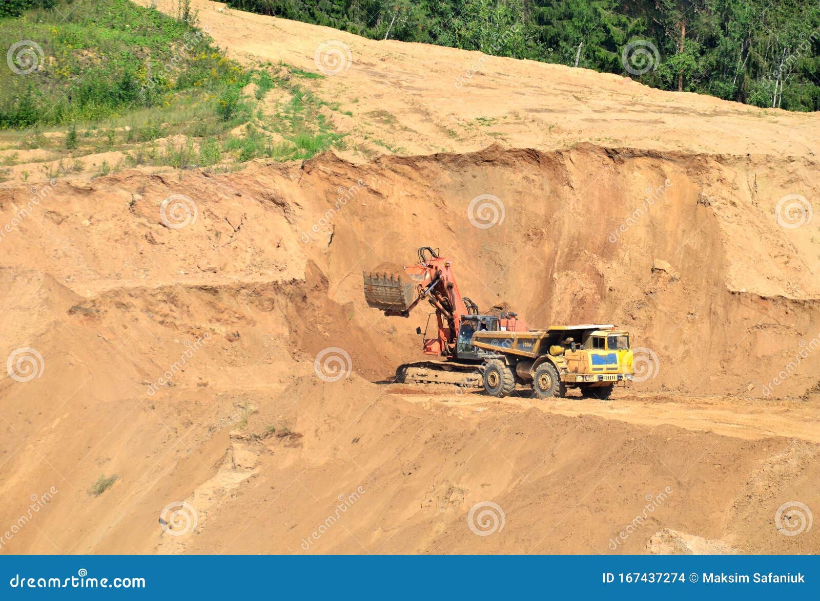 Excavator Developing the Sand on the Opencast and Loading it To the