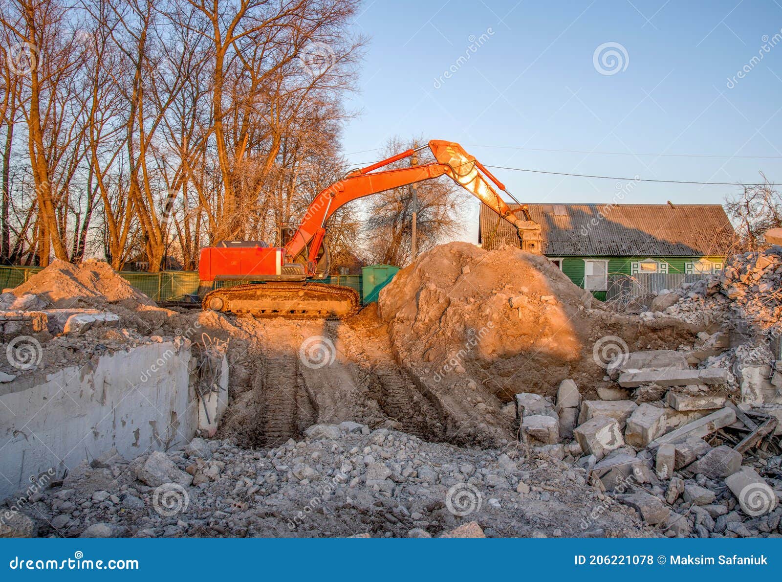 Excavator with Hydraulic Breaker Hammer for the Destruction of Concrete