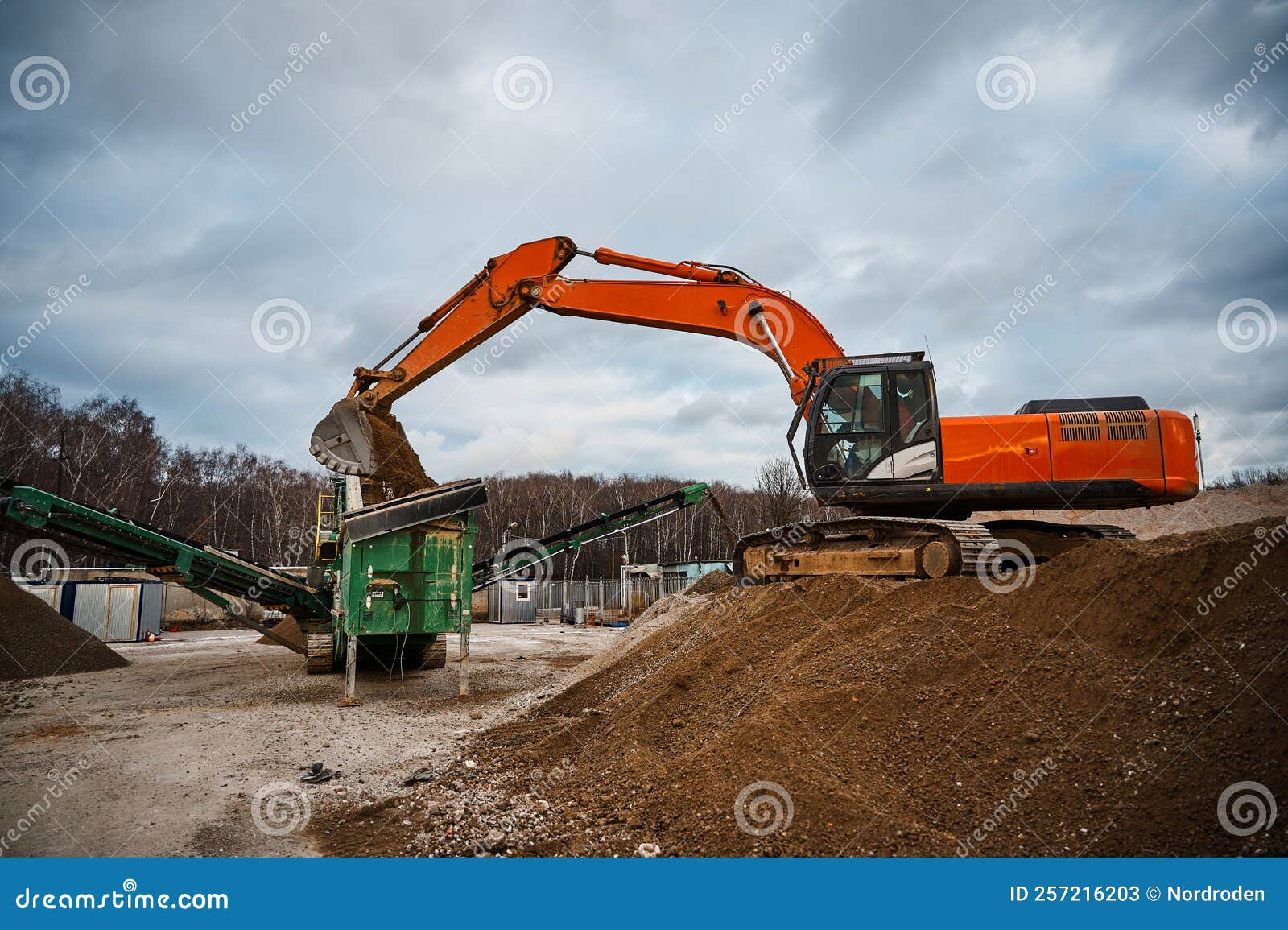 Excavator Loads Soil in Mobile Crushing and Sorting Complex Stock Image