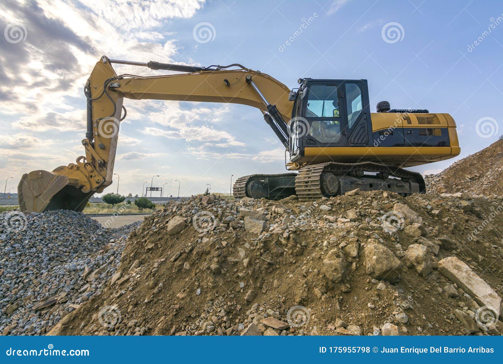 Excavator in a Quarry Extracting StoneExcavator in a Quarry Extracting