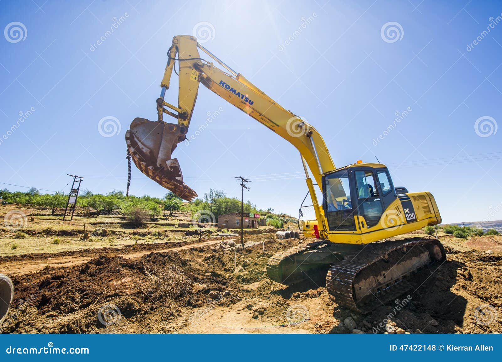 Excavator working on road. editorial stock photo. Image of digging