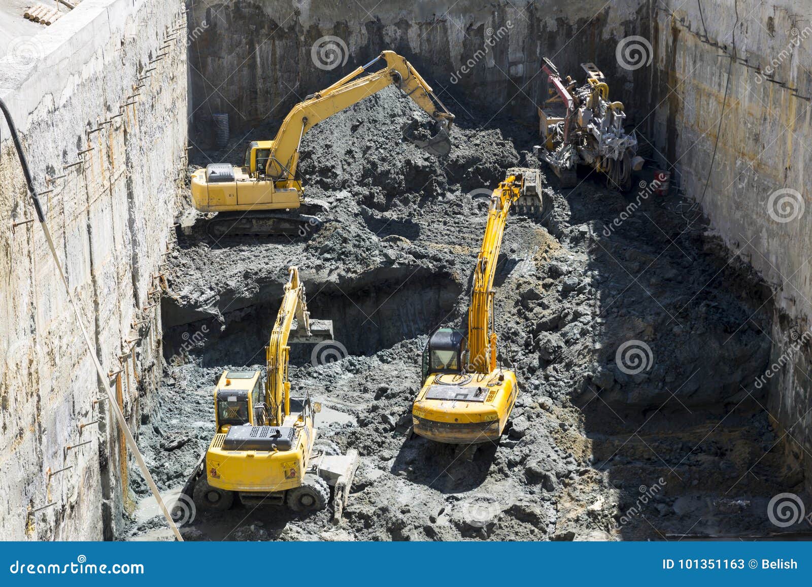 excavators baggers digging at a construction site