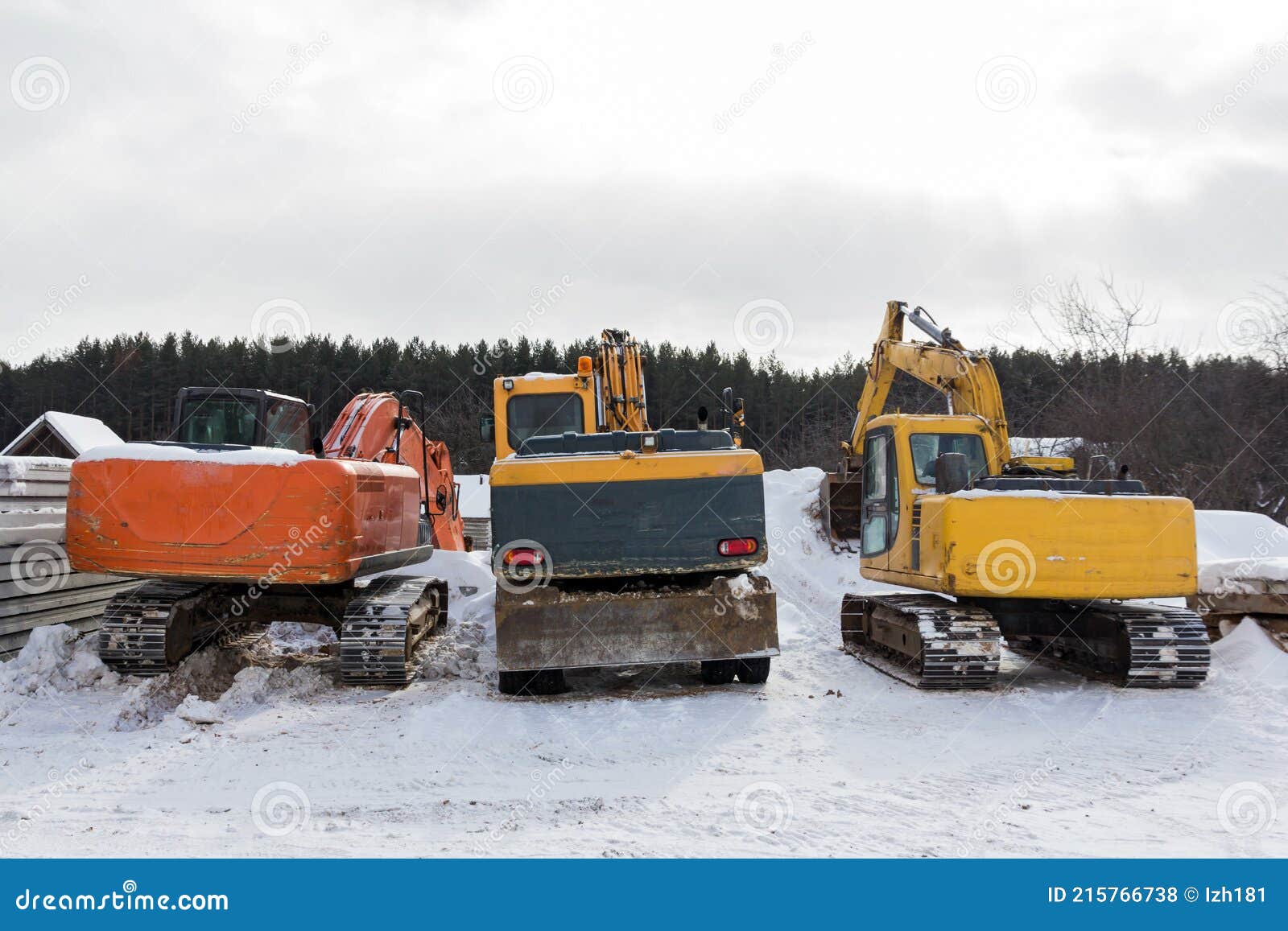 Excavators in the Parking Lot. Construction Equipment in the Parking Lot. Old Excavators are