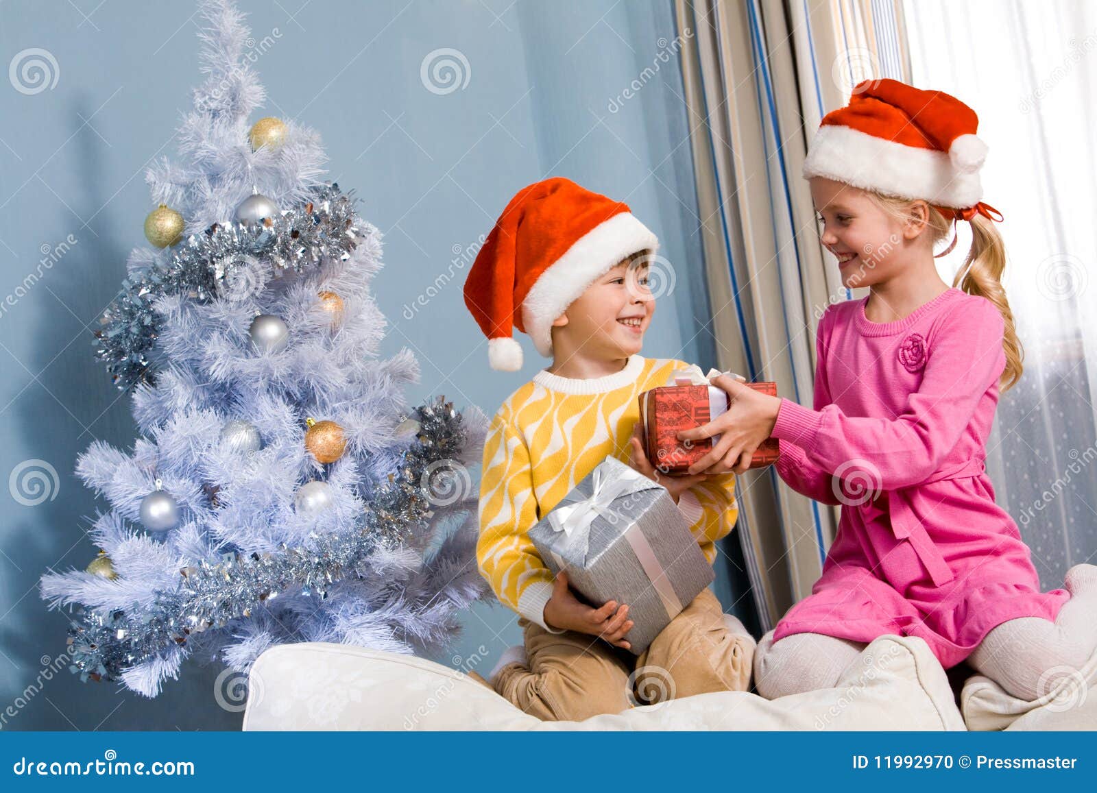 Exchanging gifts stock photo. Image of christmas, celebration 11992970