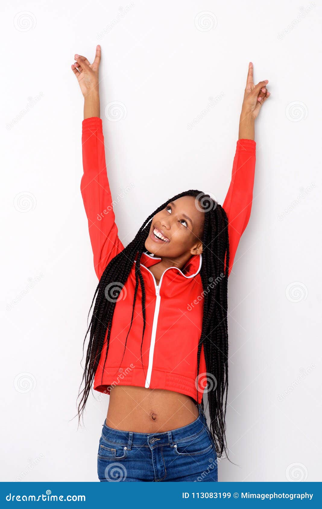 excited african american girl pointing up on white background