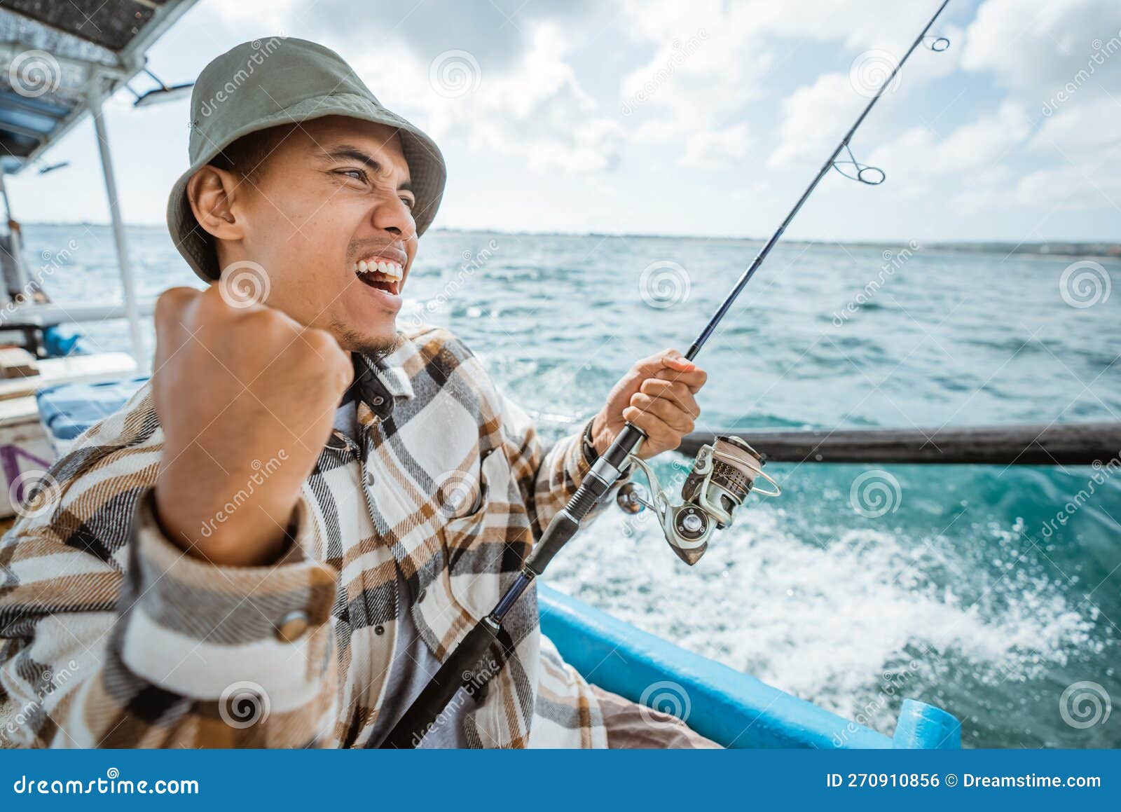 Excited Asian Fisherman on Strike when Fishing at Sea Stock Photo - Image  of excited, fisherman: 270910856