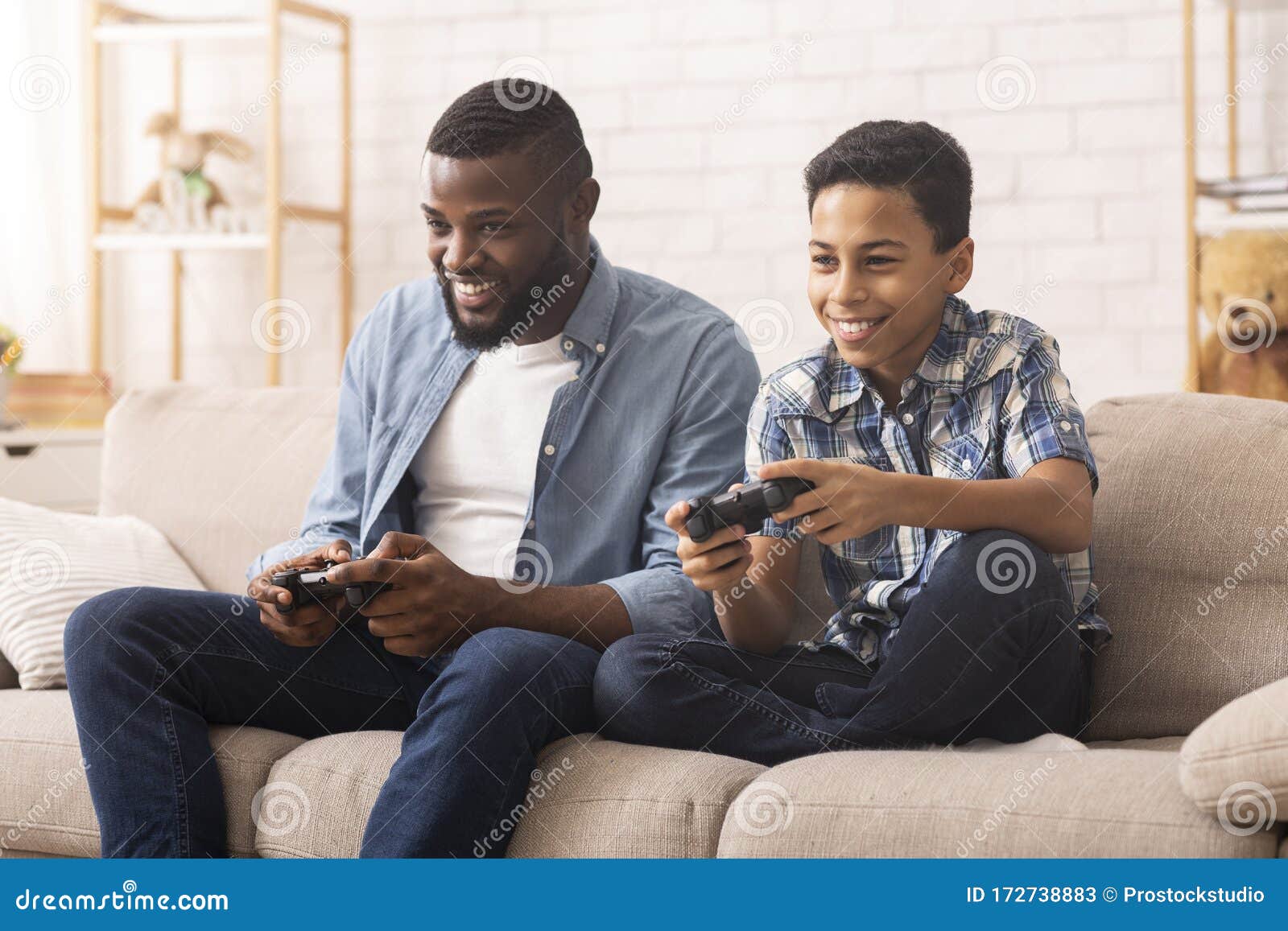 Having Fun at Home. Cheerful Black Teen Guy with Joystick Playing Online  Computer Games, Sitting on Couch Indoors Stock Image - Image of computer,  person: 227478857