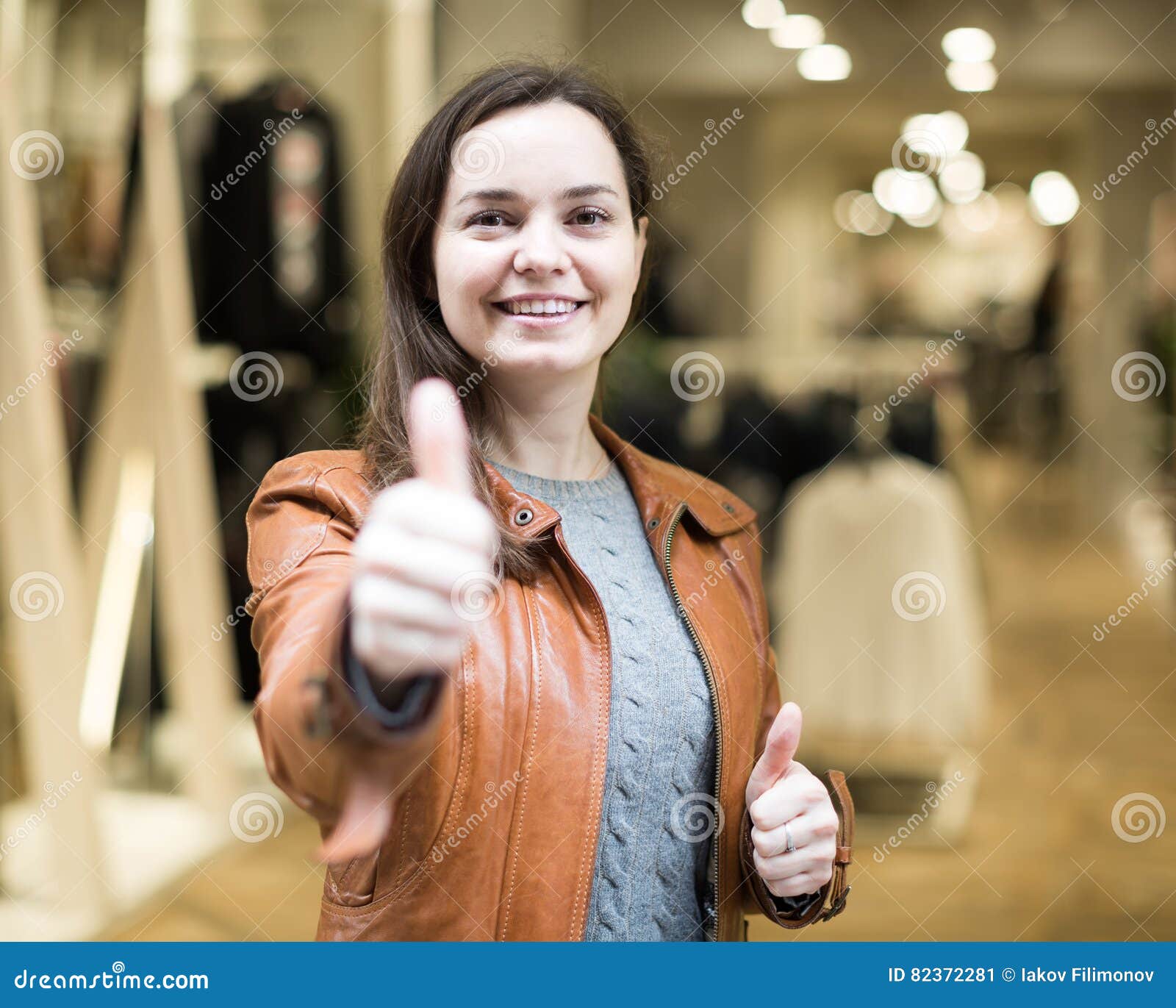 Excited Brunette Posing In Clothing Store And Smiling Stock Image Image Of Pleasure Long